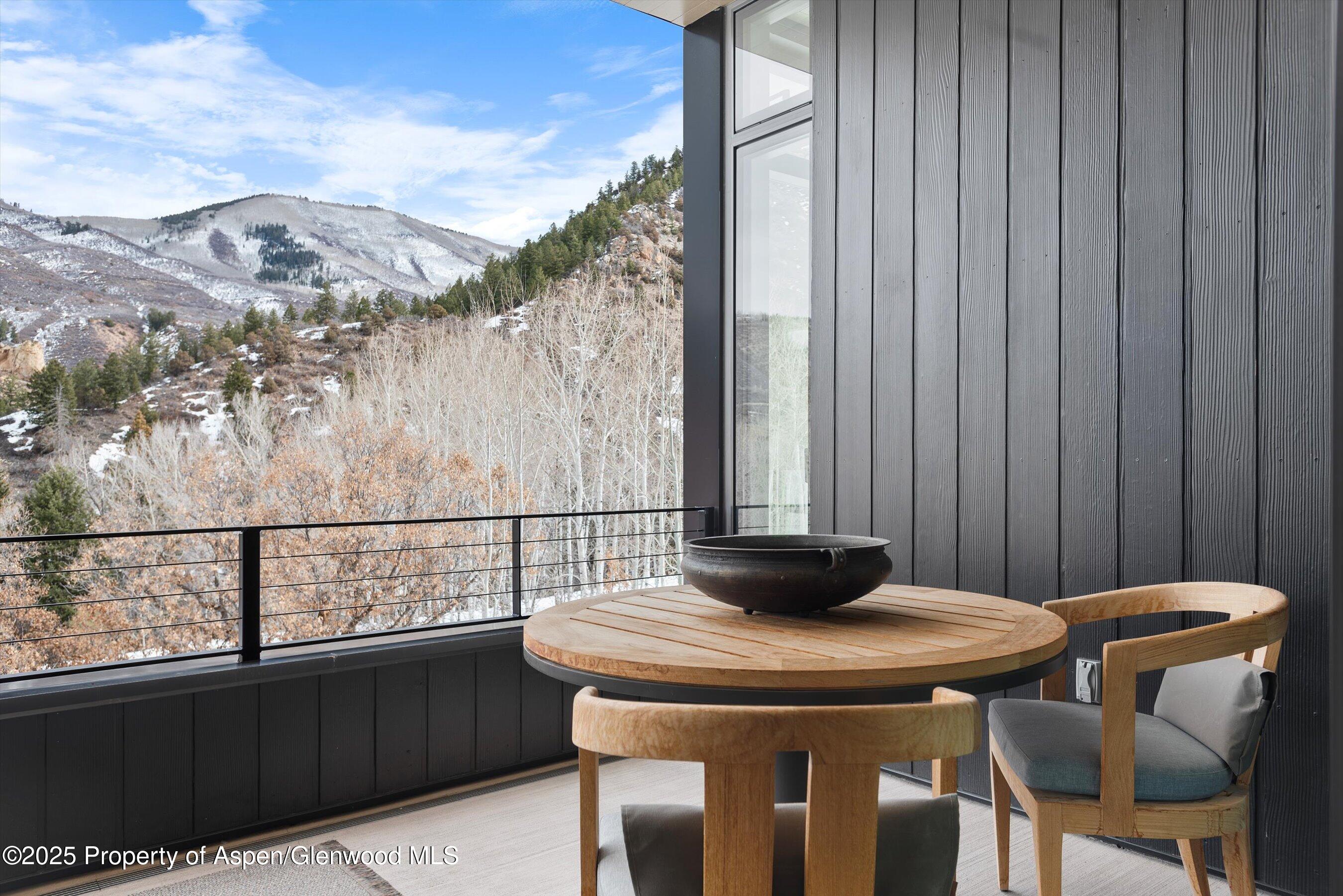 276 Coach Road Aspen, CO 81611 - Photo 44 of 54 a view of a balcony with table and chairs
