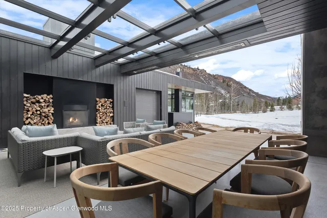 a bedroom with a large window and a bed