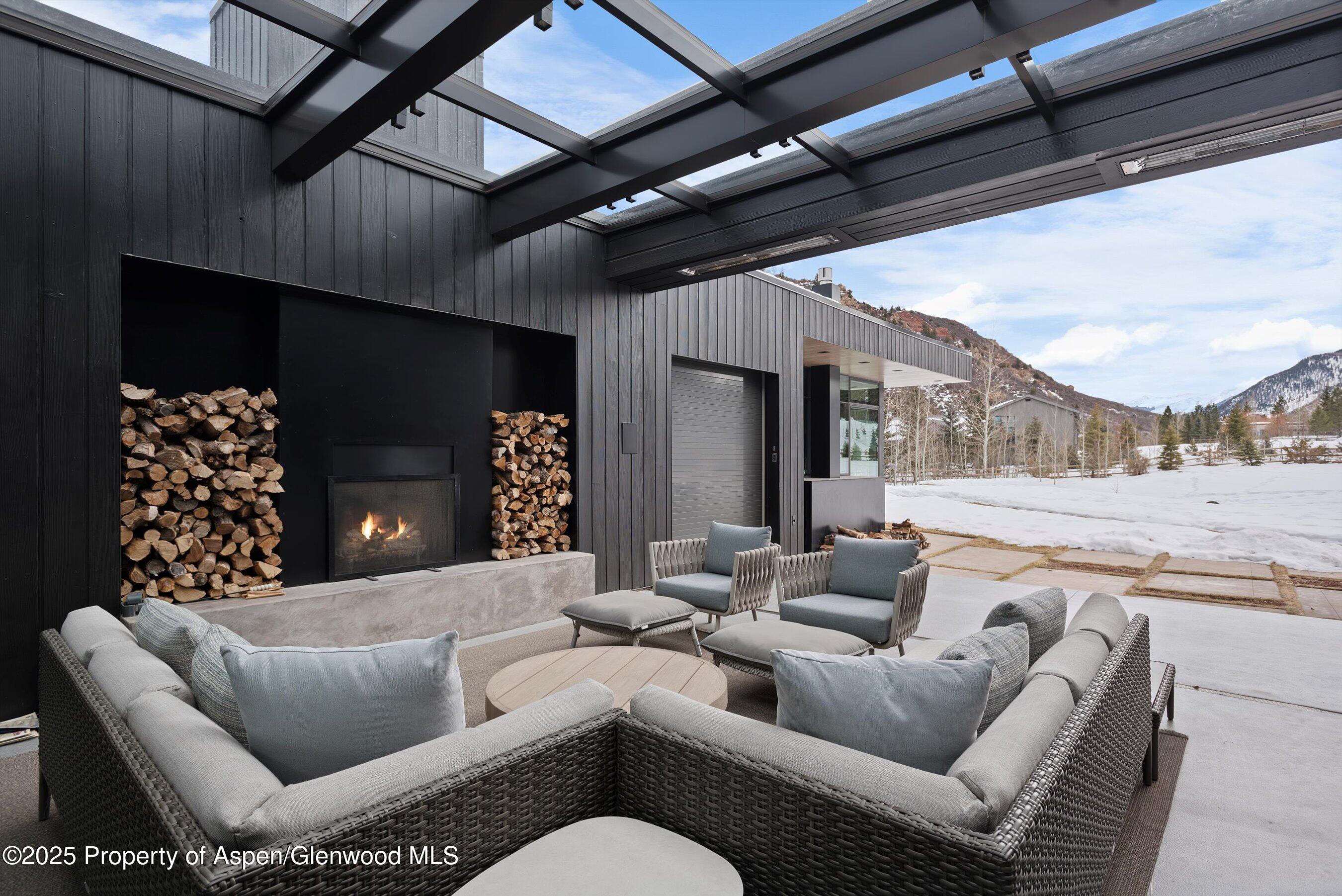 276 Coach Road Aspen, CO 81611 - Photo 48 of 54 a outdoor living space with furniture and a fireplace