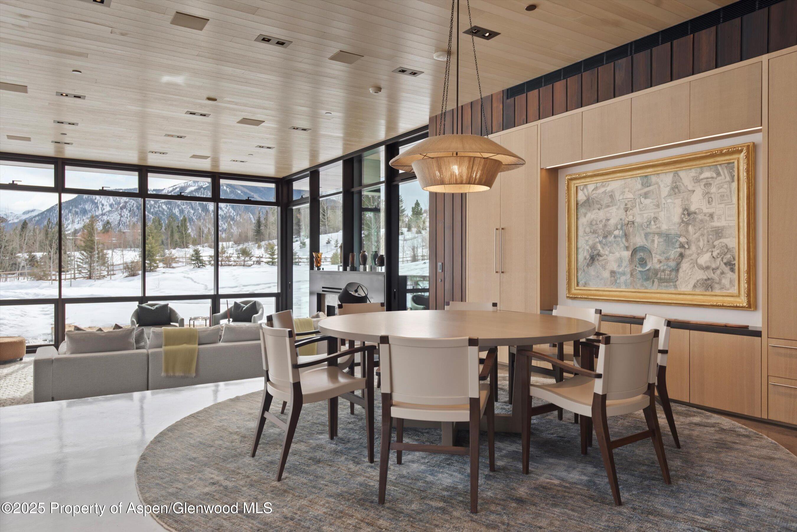276 Coach Road Aspen, CO 81611 - Photo 7 of 54 a dining hall with stainless steel appliances kitchen island granite countertop furniture and a large window