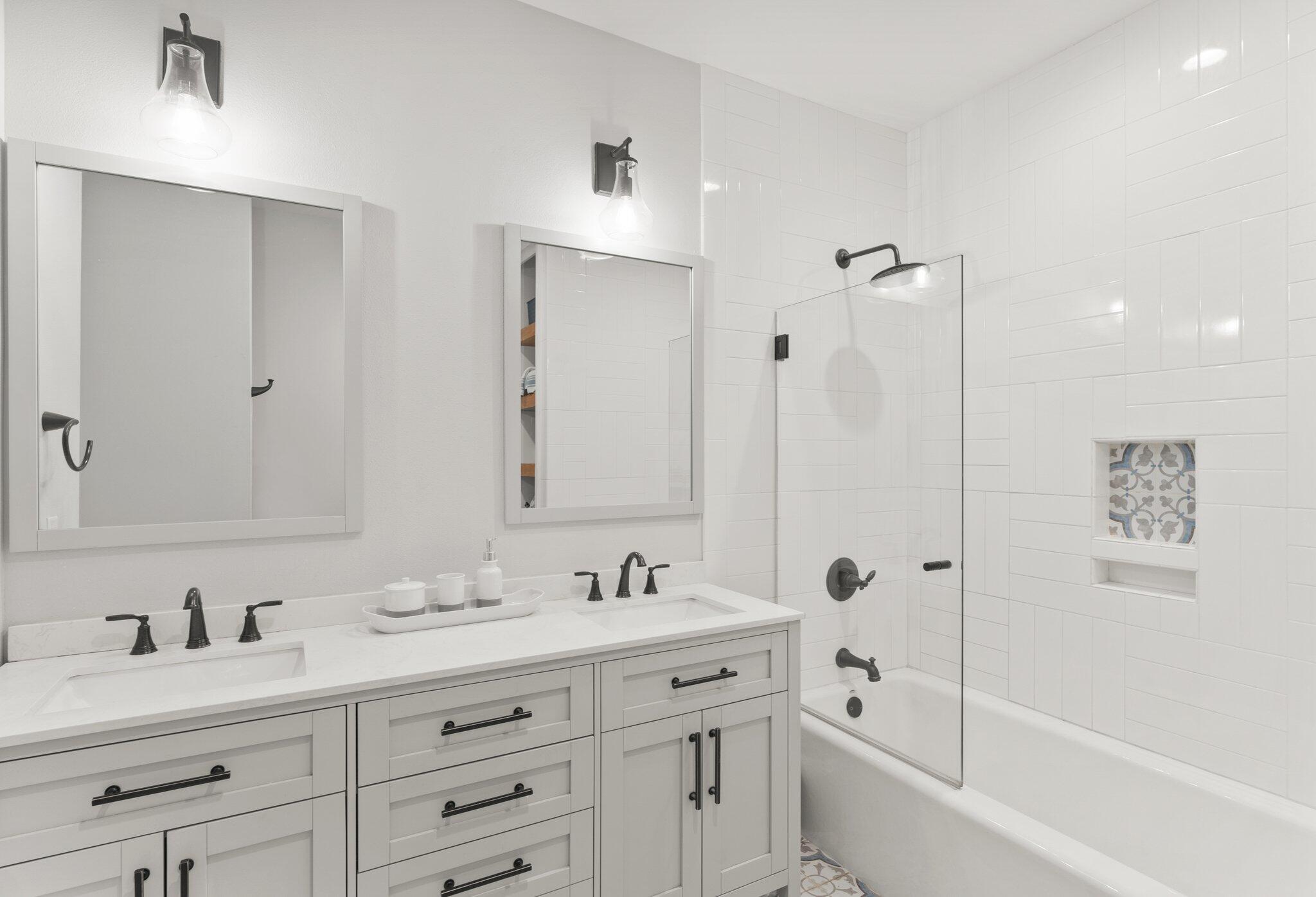 55 Vantage Point Miramar Beach, FL 32550 - Photo 19 of 38 a bathroom with a granite countertop sink mirror and a bathtub