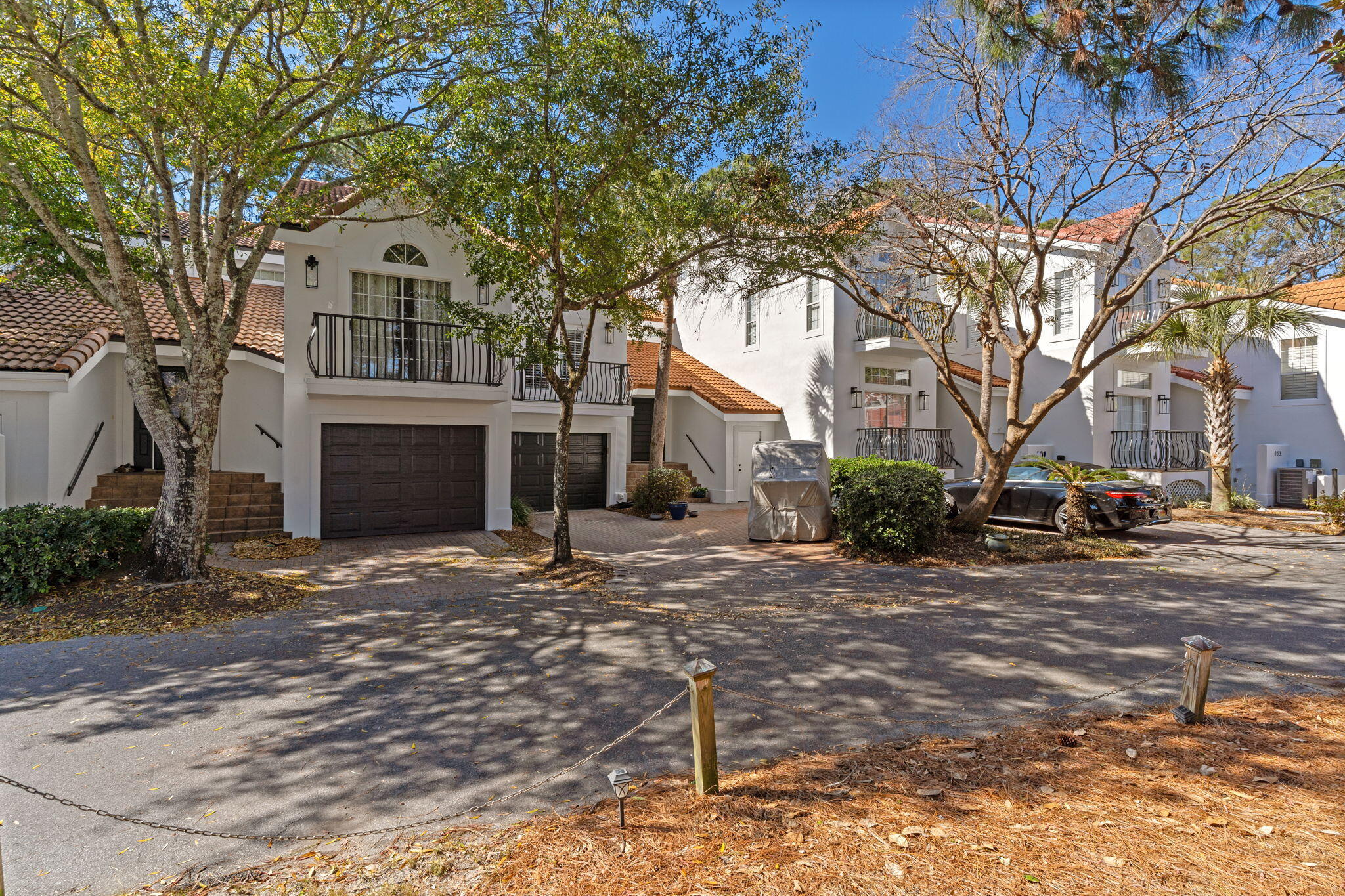 55 Vantage Point Miramar Beach, FL 32550 - Photo 4 of 38 a front view of a house with a yard and garage