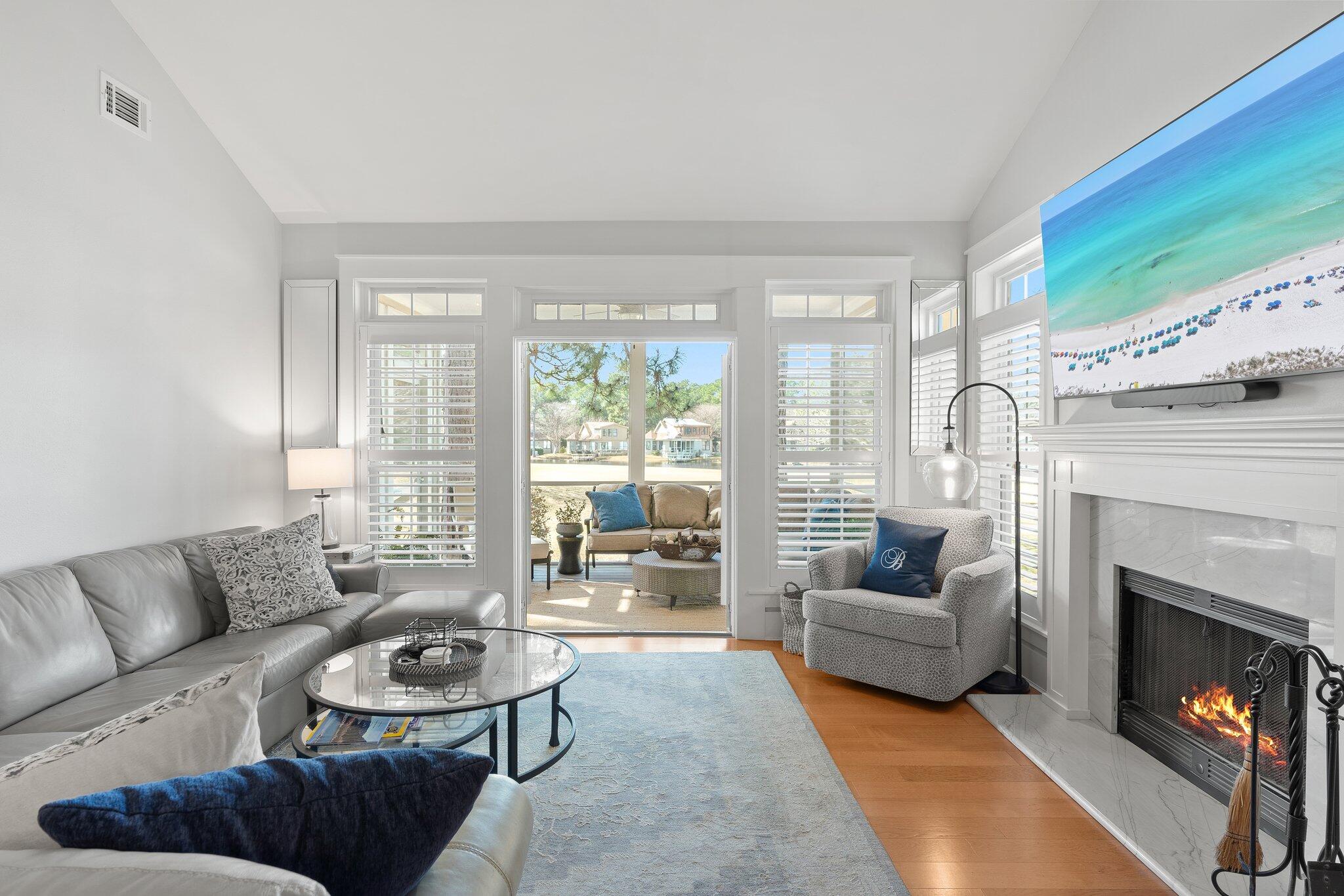 55 Vantage Point Miramar Beach, FL 32550 - Photo 8 of 38 a living room with furniture and a fireplace