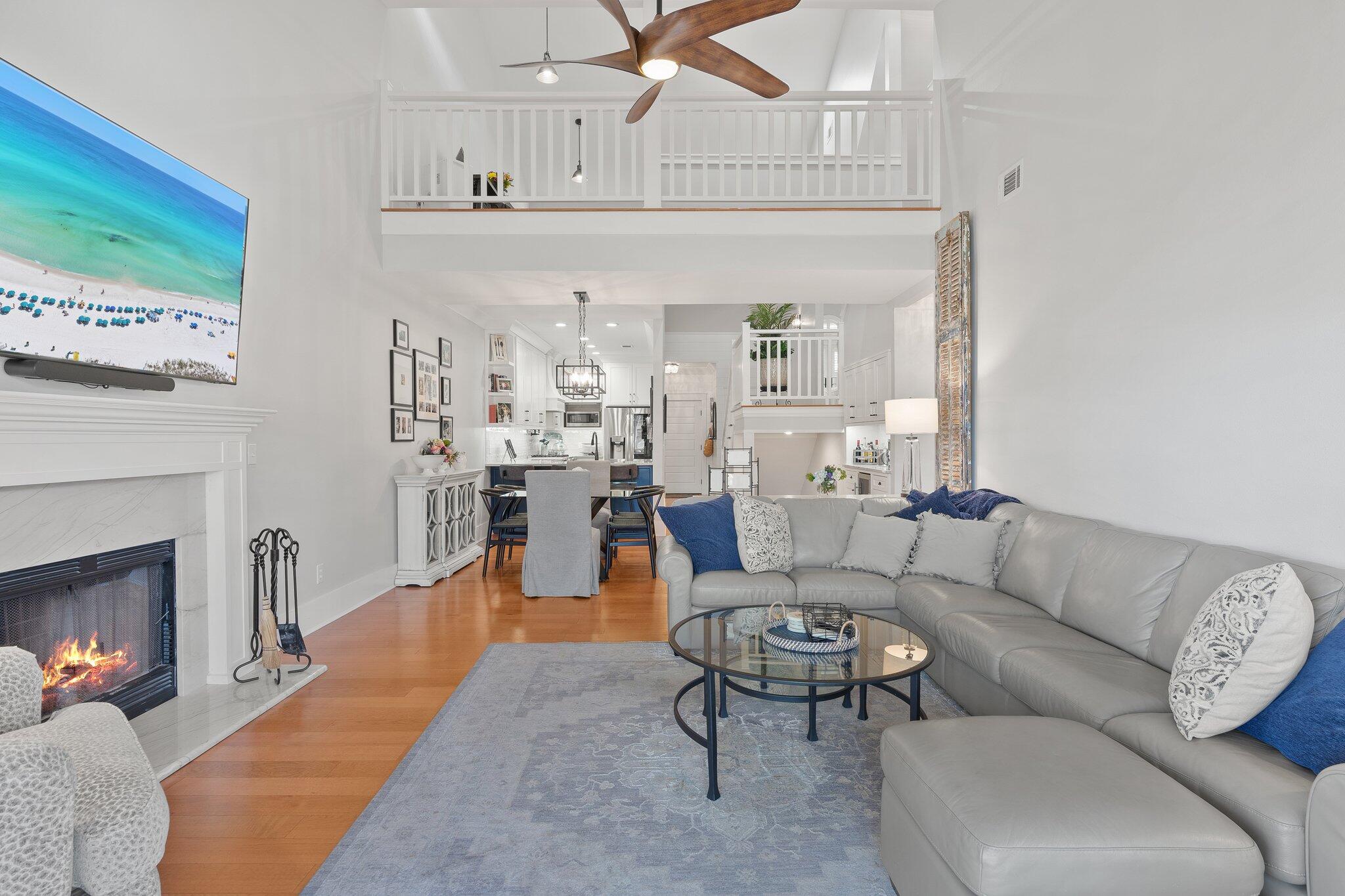 55 Vantage Point Miramar Beach, FL 32550 - Photo 9 of 38 a living room with furniture and a fireplace