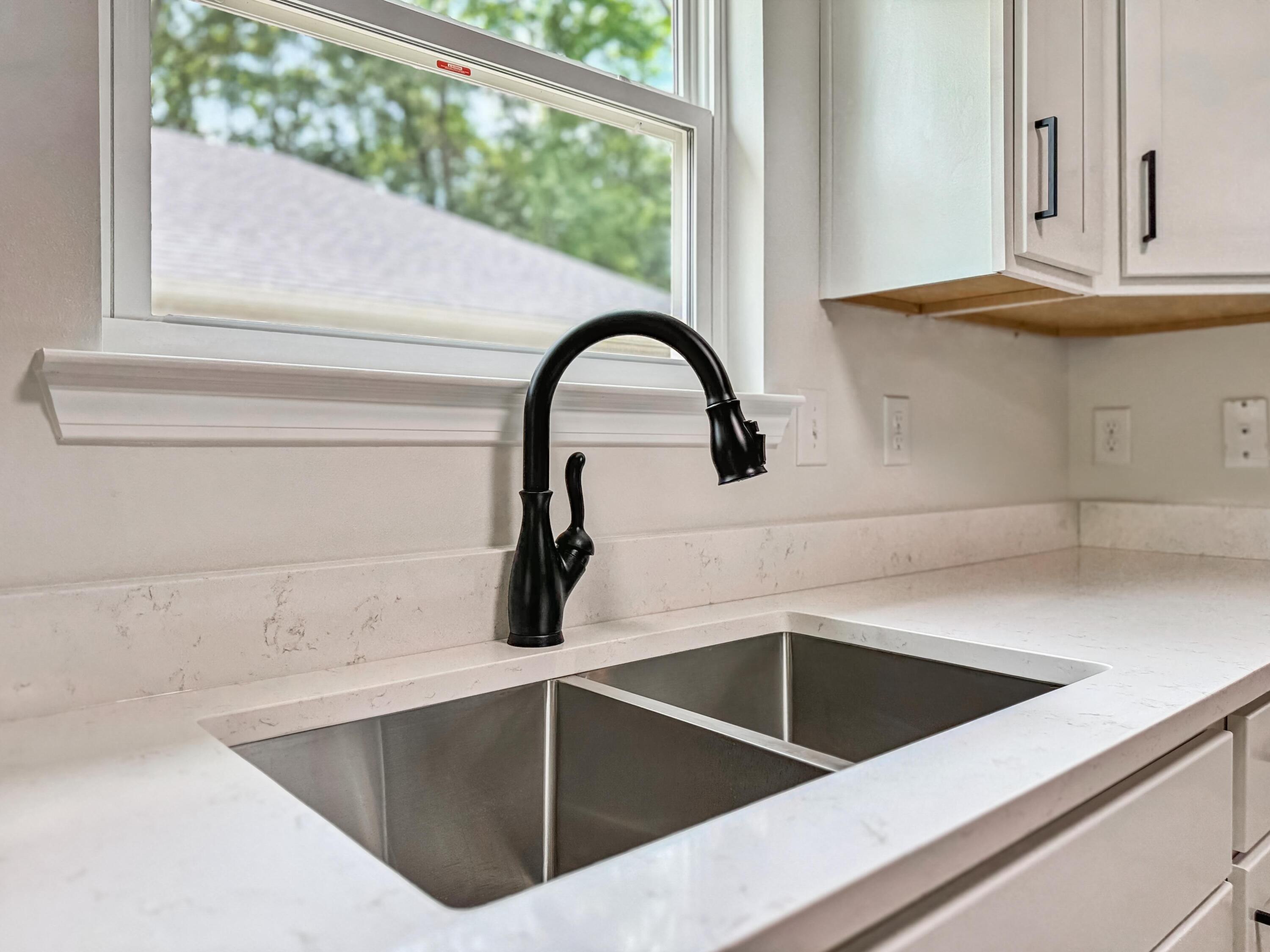 8084 3rd Street Laurel Hill, FL 32567 - Photo 14 of 34 a close view of sink and tap