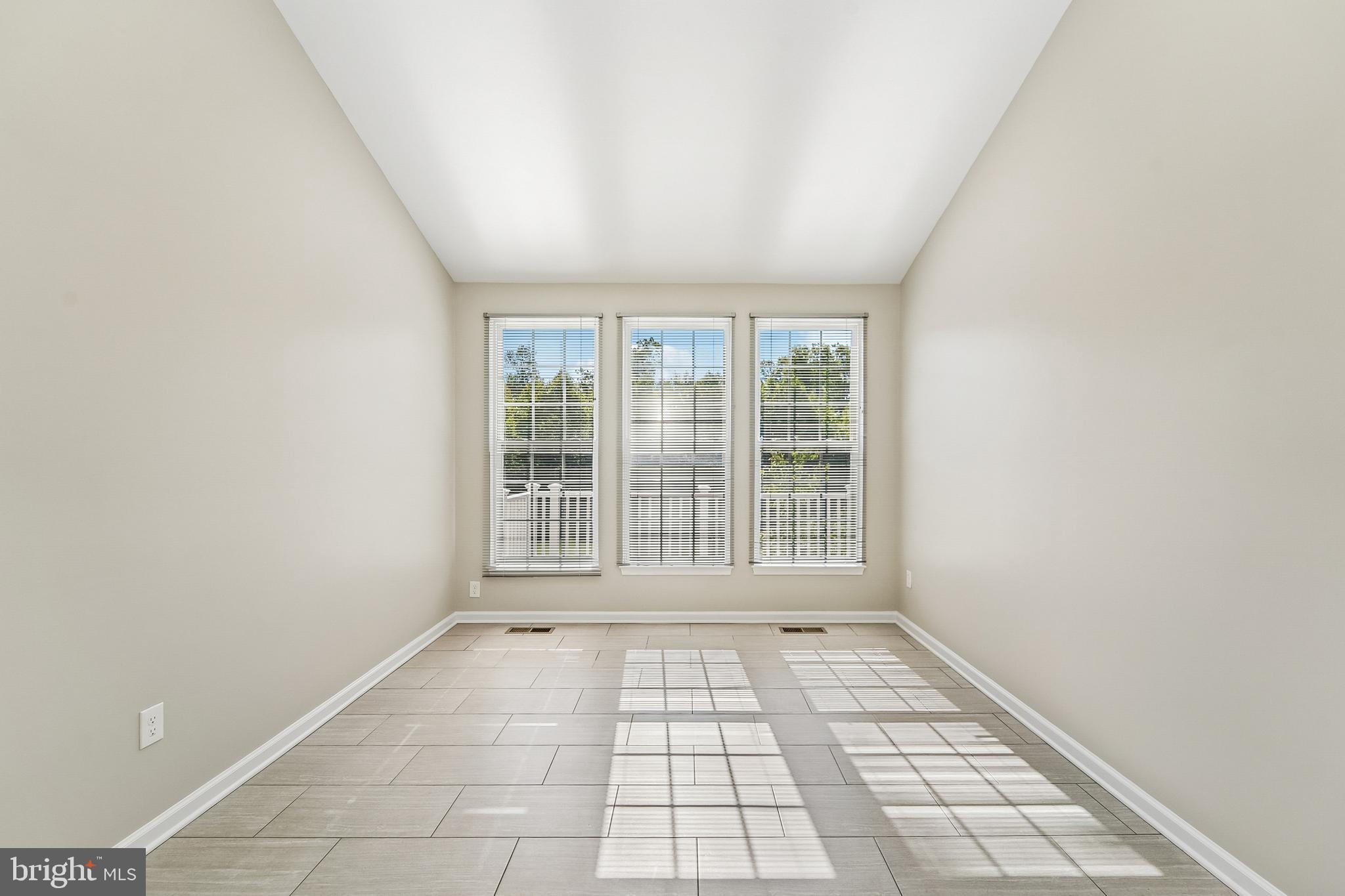 1461 Pangbourne Way Hanover, MD 21076 - Photo 20 of 51 a view of empty room with wooden floor and fan