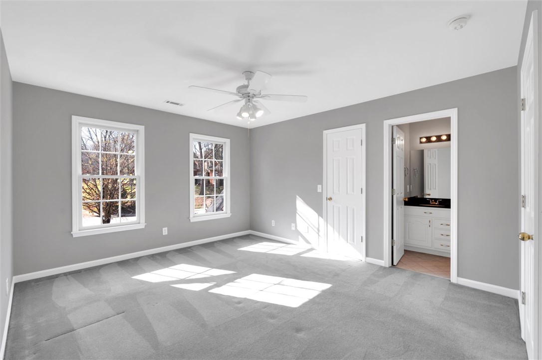 204 Red Maple Way Clemson, SC 29631 - Photo 30 of 48 This spacious bedroom offers ample natural light and direct access to a private bathroom.