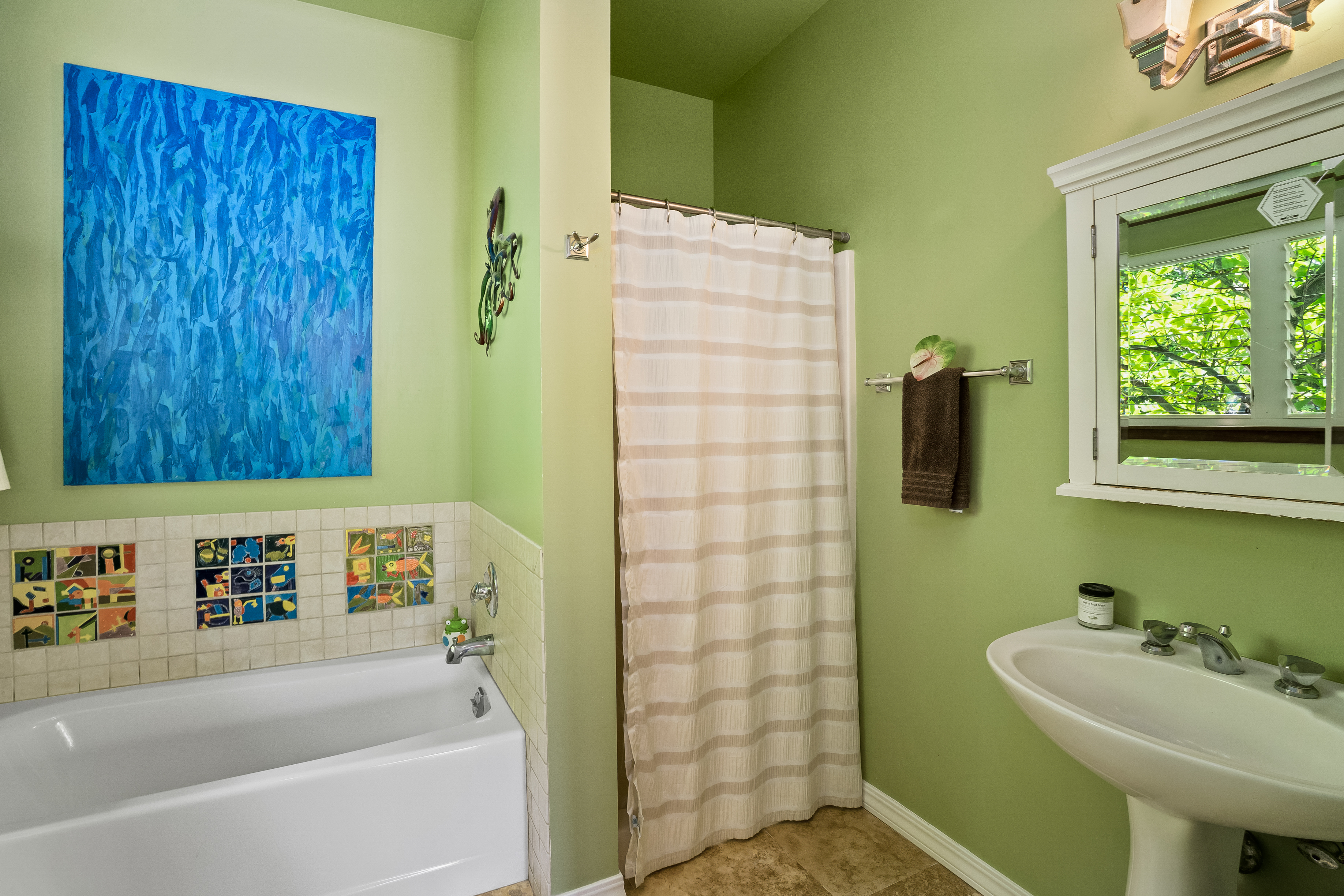 5728 Olohena Road Kapaa, HI 96746 - Photo 11 of 30 a bathroom with a sink and a bathtub