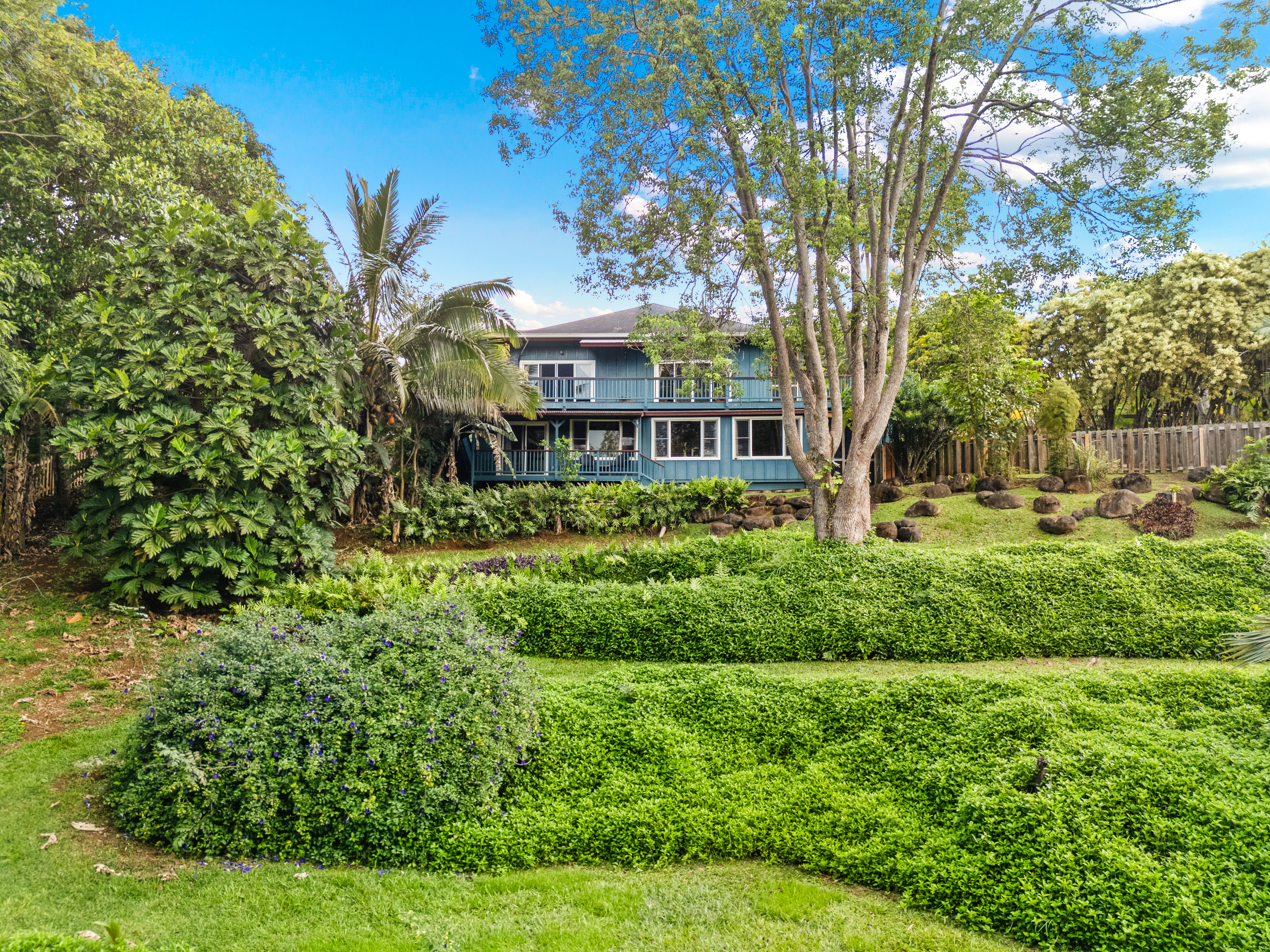 5728 Olohena Road Kapaa, HI 96746 - Photo 13 of 30 a view of a house with a garden