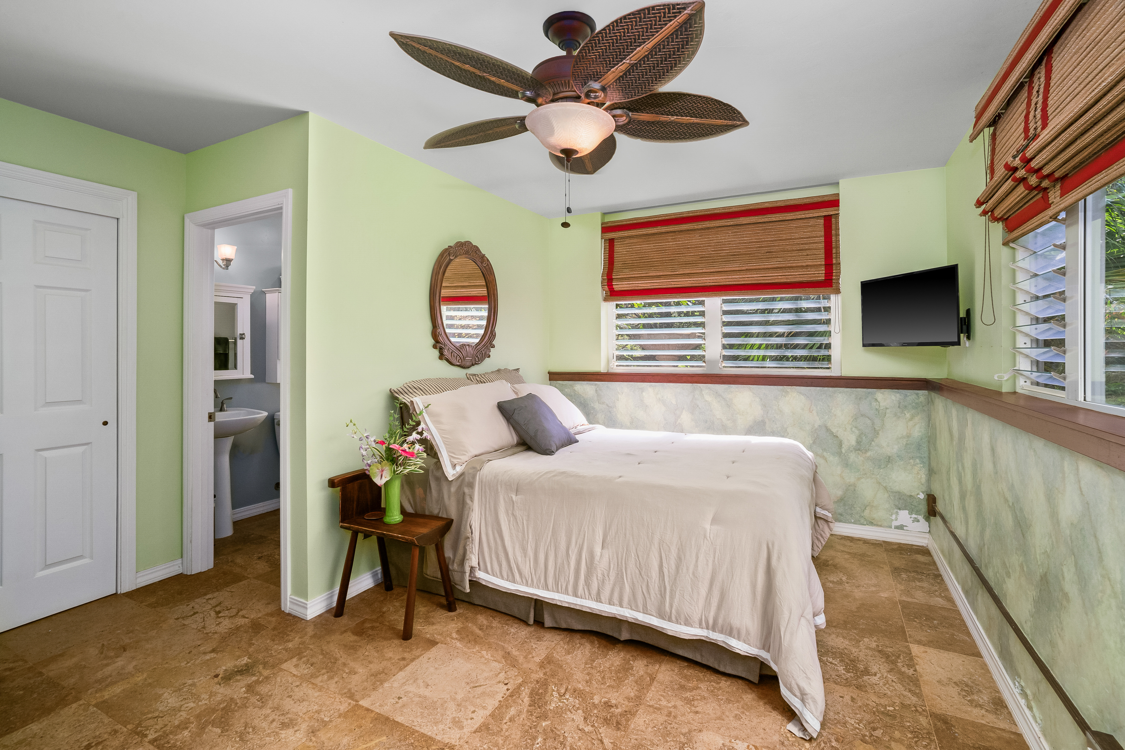 5728 Olohena Road Kapaa, HI 96746 - Photo 17 of 30 a bedroom with a bed and a window