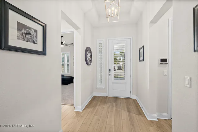 a view of a hallway with front door