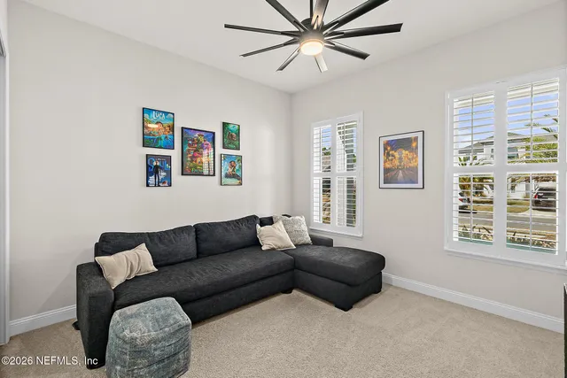 a living room with furniture and a window