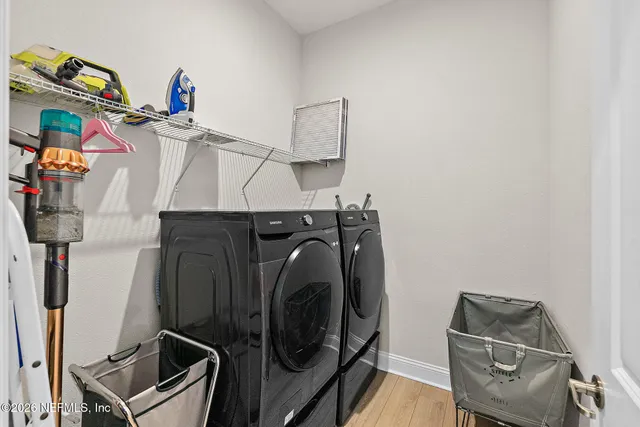 a utility room with dryer and washer