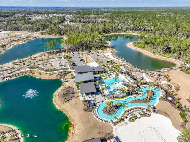 a view of a swimming pool with a yard