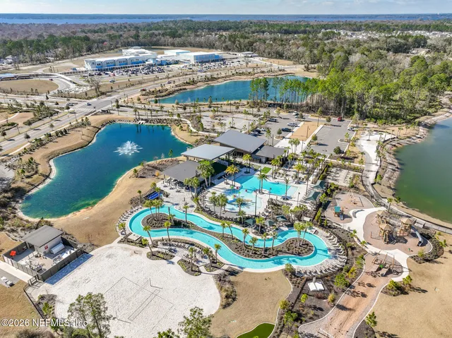 an aerial view of a house with a ocean view