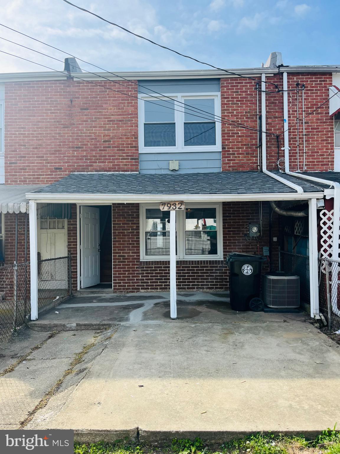 7932 Wynbrook Road Baltimore, MD 21224 - Photo 12 of 13 front view of a brick house with a garage