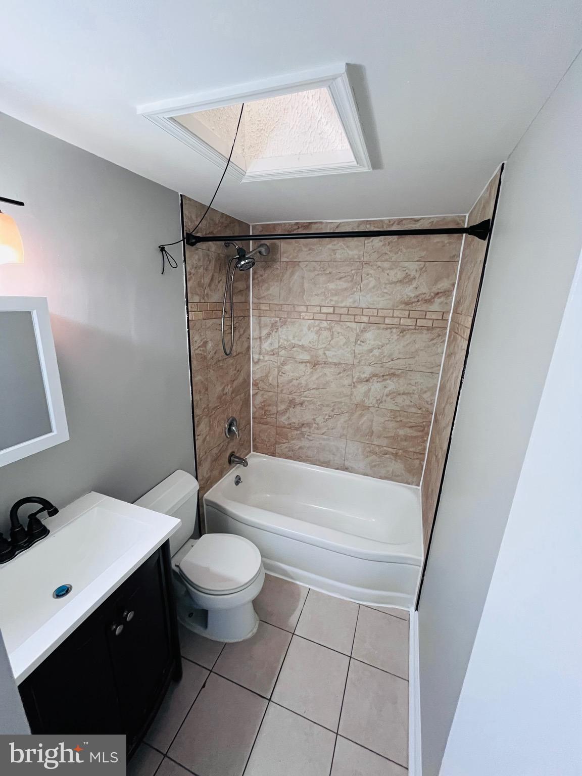 7932 Wynbrook Road Baltimore, MD 21224 - Photo 8 of 13 a bathroom with a bathtub a toilet a sink and a shower