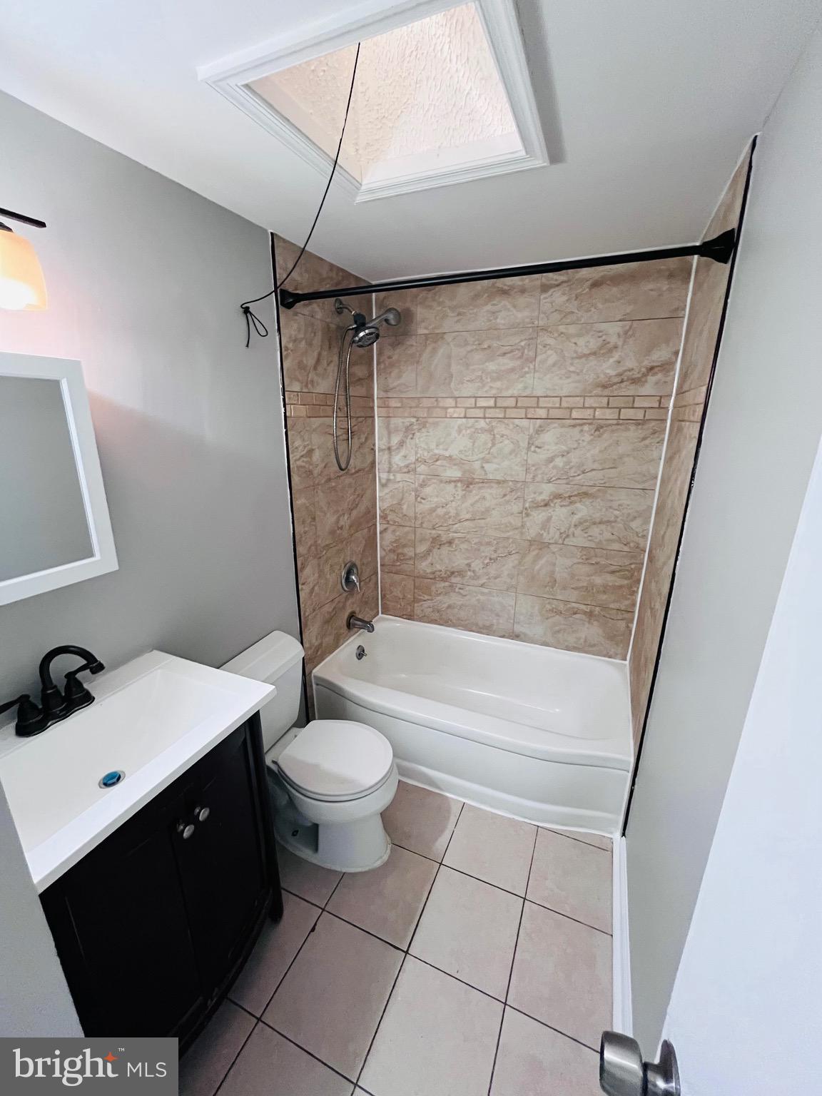 7932 Wynbrook Road Baltimore, MD 21224 - Photo 9 of 13 a bathroom with a sink a toilet and shower