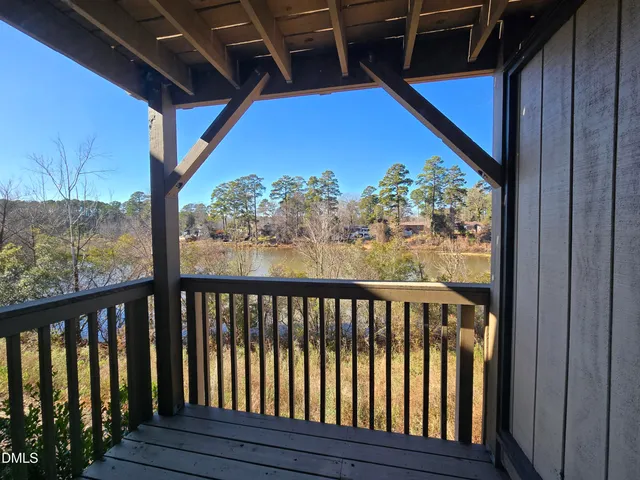 a view of balcony with wooden floor