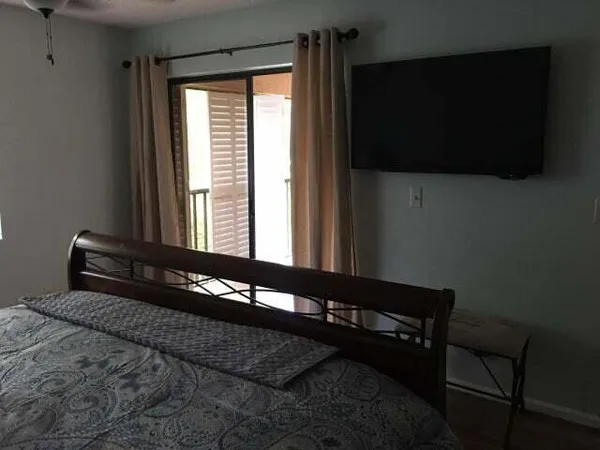 a black and white photo of a bedroom