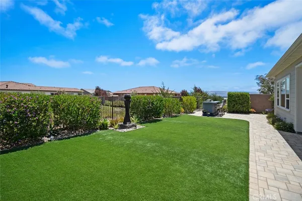 a view of a house with backyard porch and sitting area
