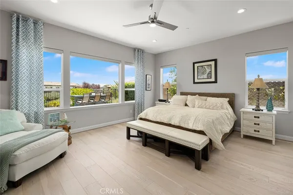 a spacious bathroom with a granite countertop sink a mirror and a