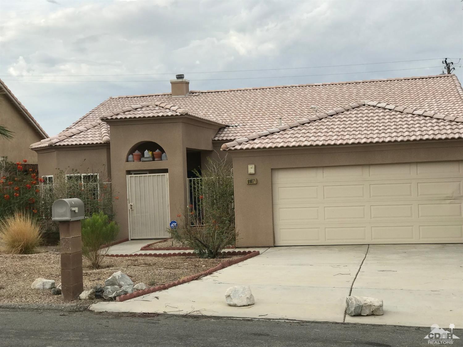 66071 Santa Rosa Road Desert Hot Springs, CA 92240 - Photo 2 of 15 a view of a house with a yard