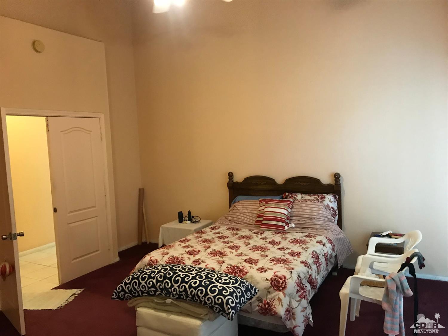 66071 Santa Rosa Road Desert Hot Springs, CA 92240 - Photo 5 of 15 a bedroom with a bed and wooden floor