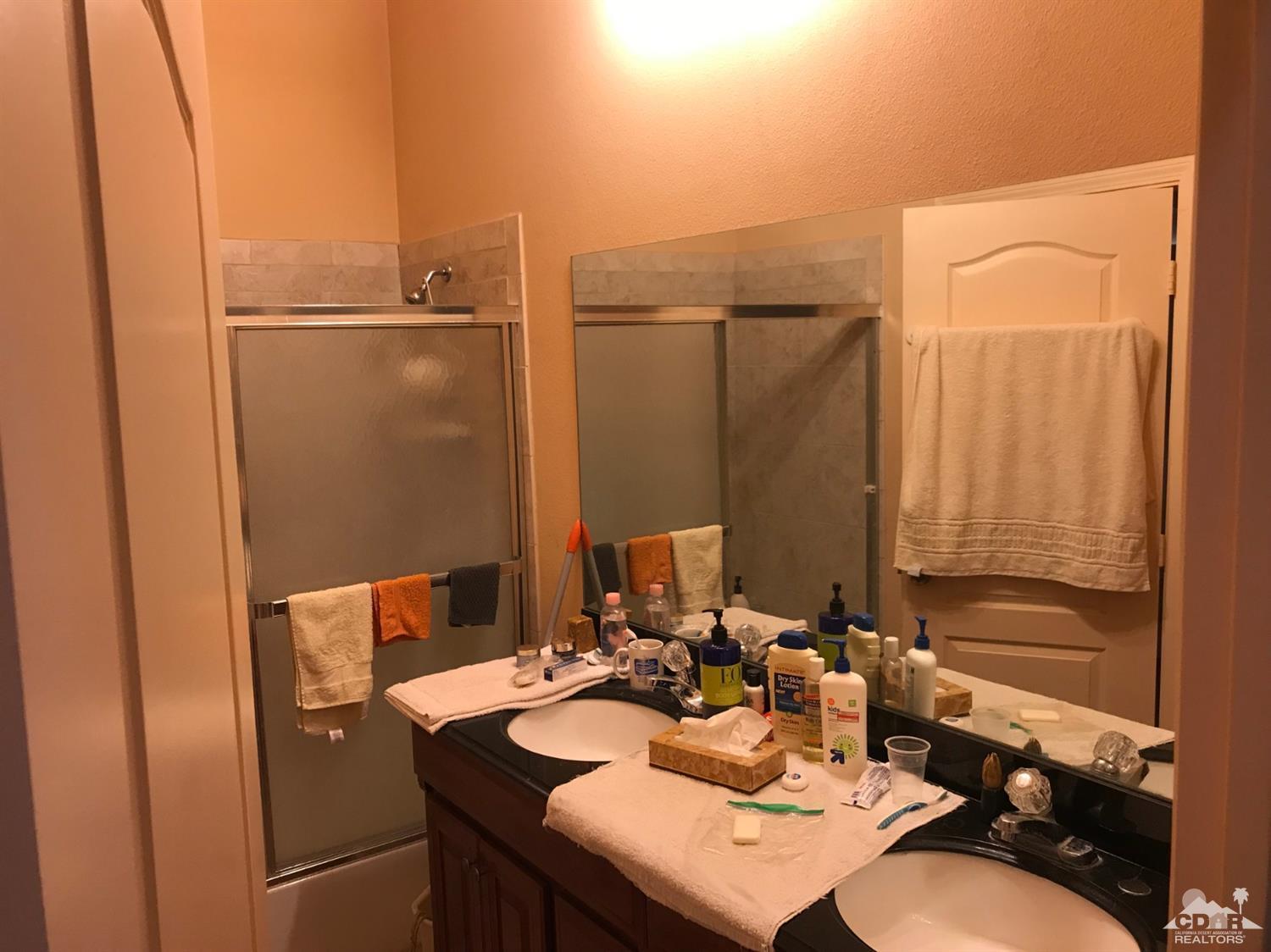 66071 Santa Rosa Road Desert Hot Springs, CA 92240 - Photo 6 of 15 a bathroom with a sink and a mirror