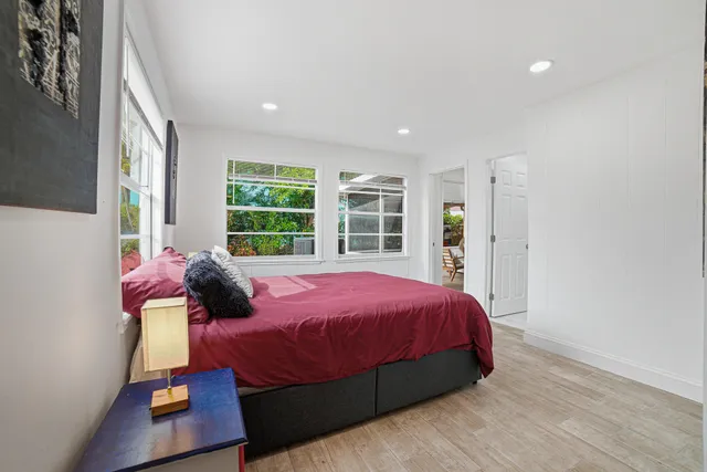 a livingroom with workspace window and a couch