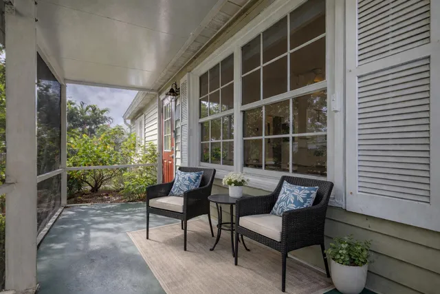 a kitchen with stainless steel appliances granite countertop a table and chairs