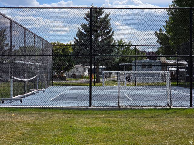 1275 Thrush Road Salt Lake City, UT 84123 - Photo 19 of 20 Multi-sport court with light blue and dark blue playing surfaces, enclosed by chain-link fencing