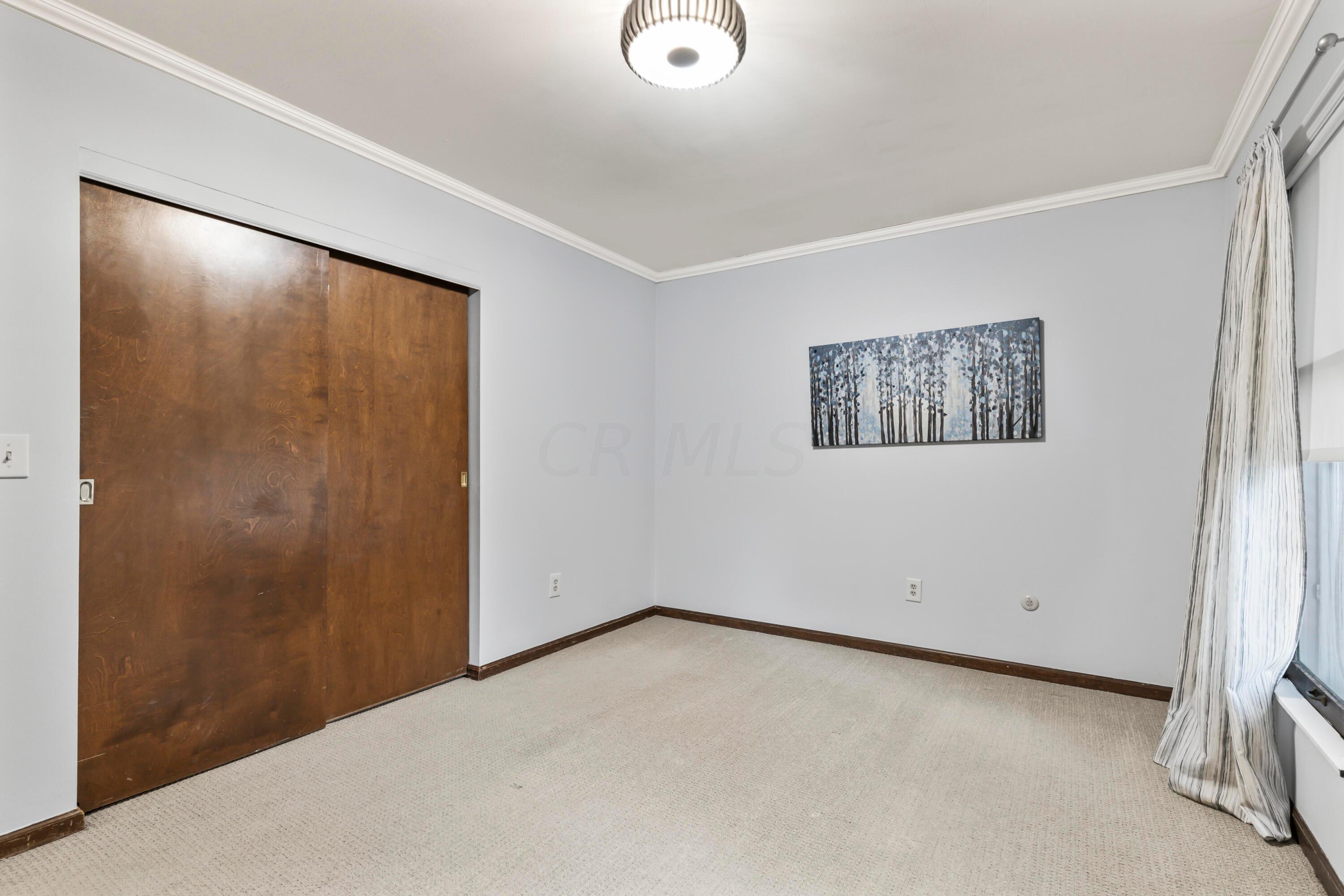 7020 Rieber Street Columbus, OH 43085 - Photo 32 of 40 • Berber carpet • Blue/grey painted walls • New ceiling light ~ 2017 • Drapes are negotiable • Closet with double sliding doors