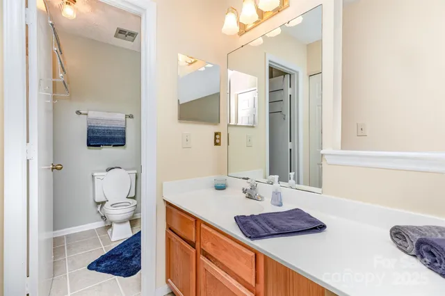 a bathroom with a bathtub shower sink and toilet