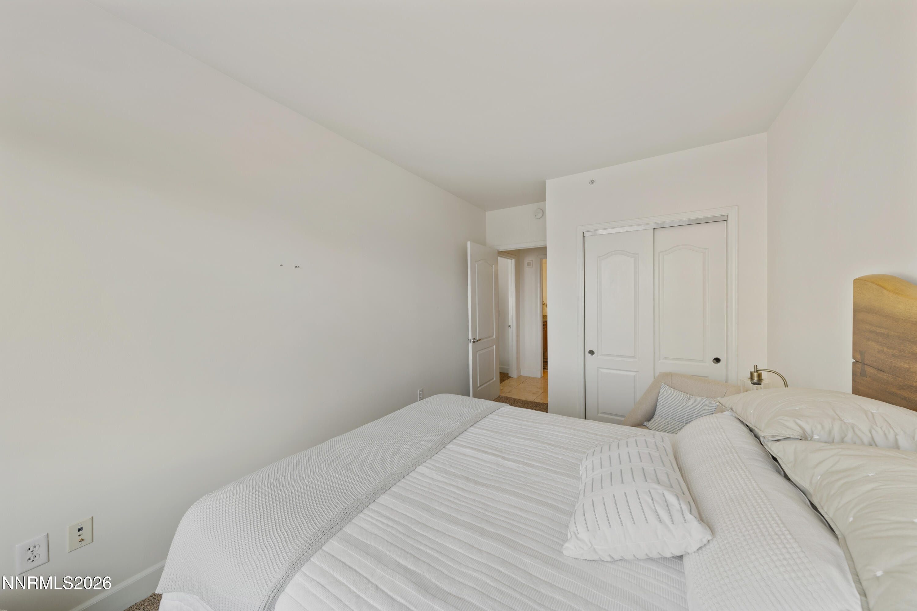 50 North Sierra Street, Unit 903 Reno, NV 89501 - Photo 30 of 61 a bedroom with a bed and a night lamp