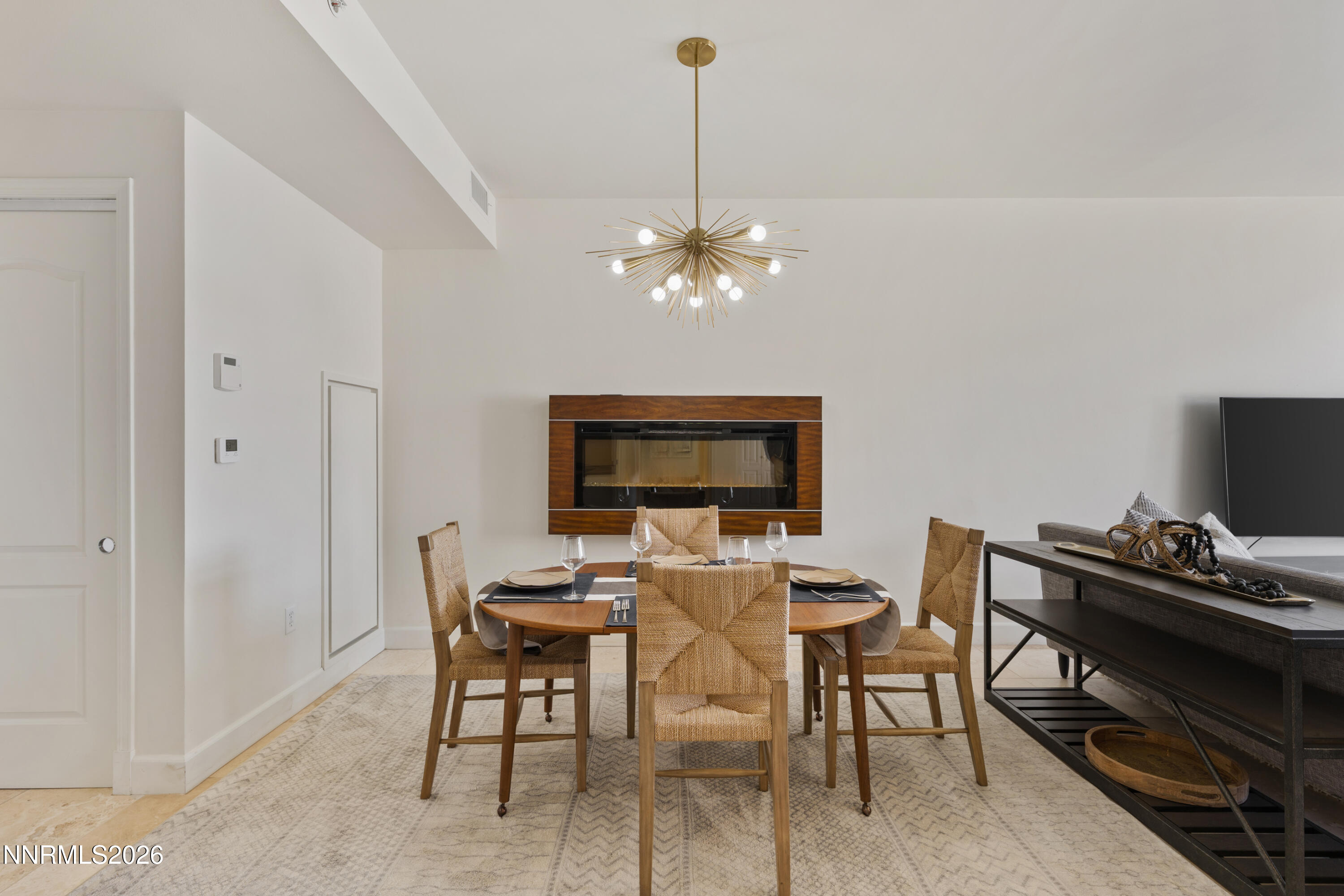 50 North Sierra Street, Unit 903 Reno, NV 89501 - Photo 3 of 61 a view of a dining room with furniture and a chandelier
