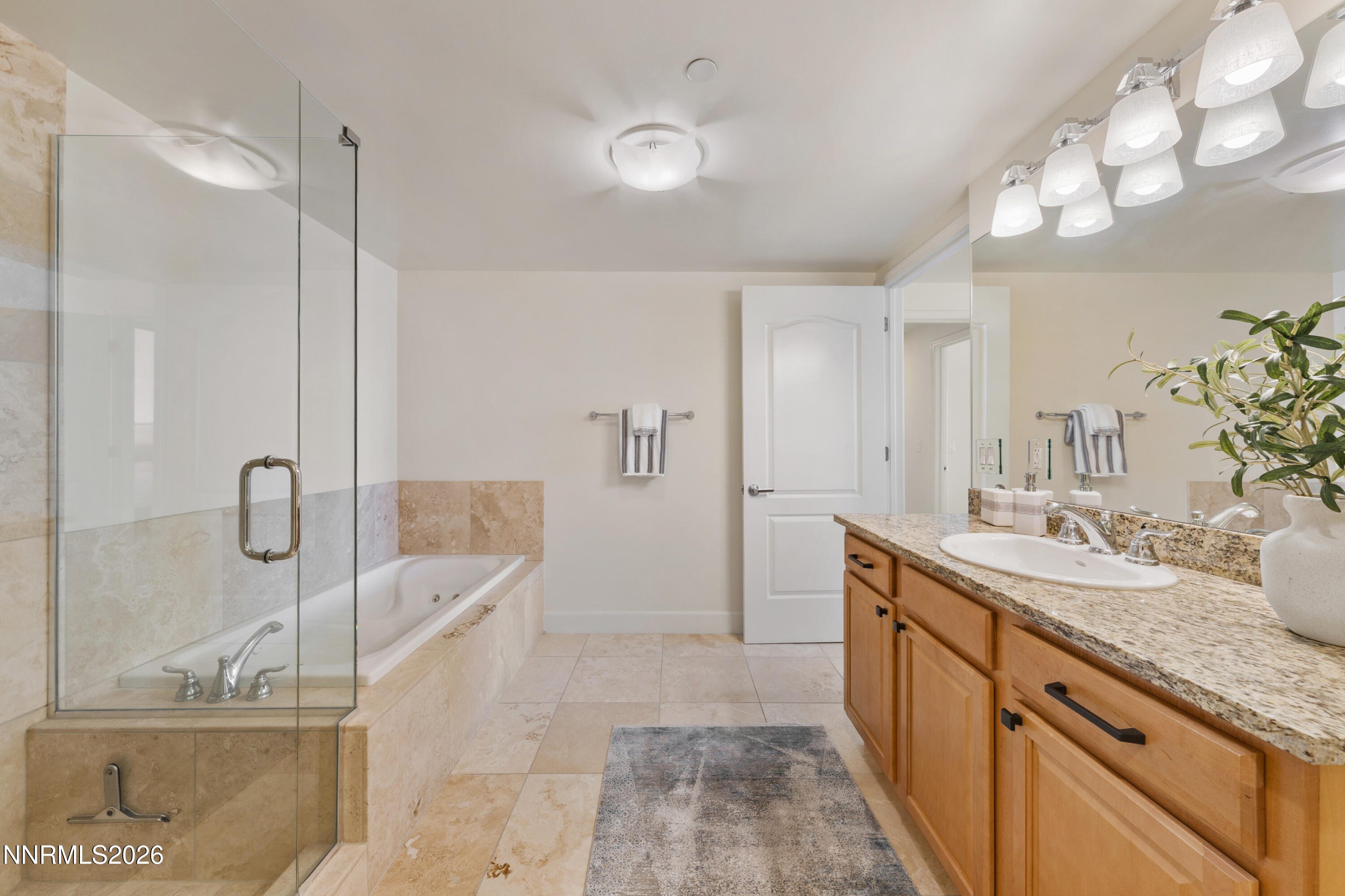 50 North Sierra Street, Unit 903 Reno, NV 89501 - Photo 33 of 61 a bathroom with a double vanity sink a mirror and shower