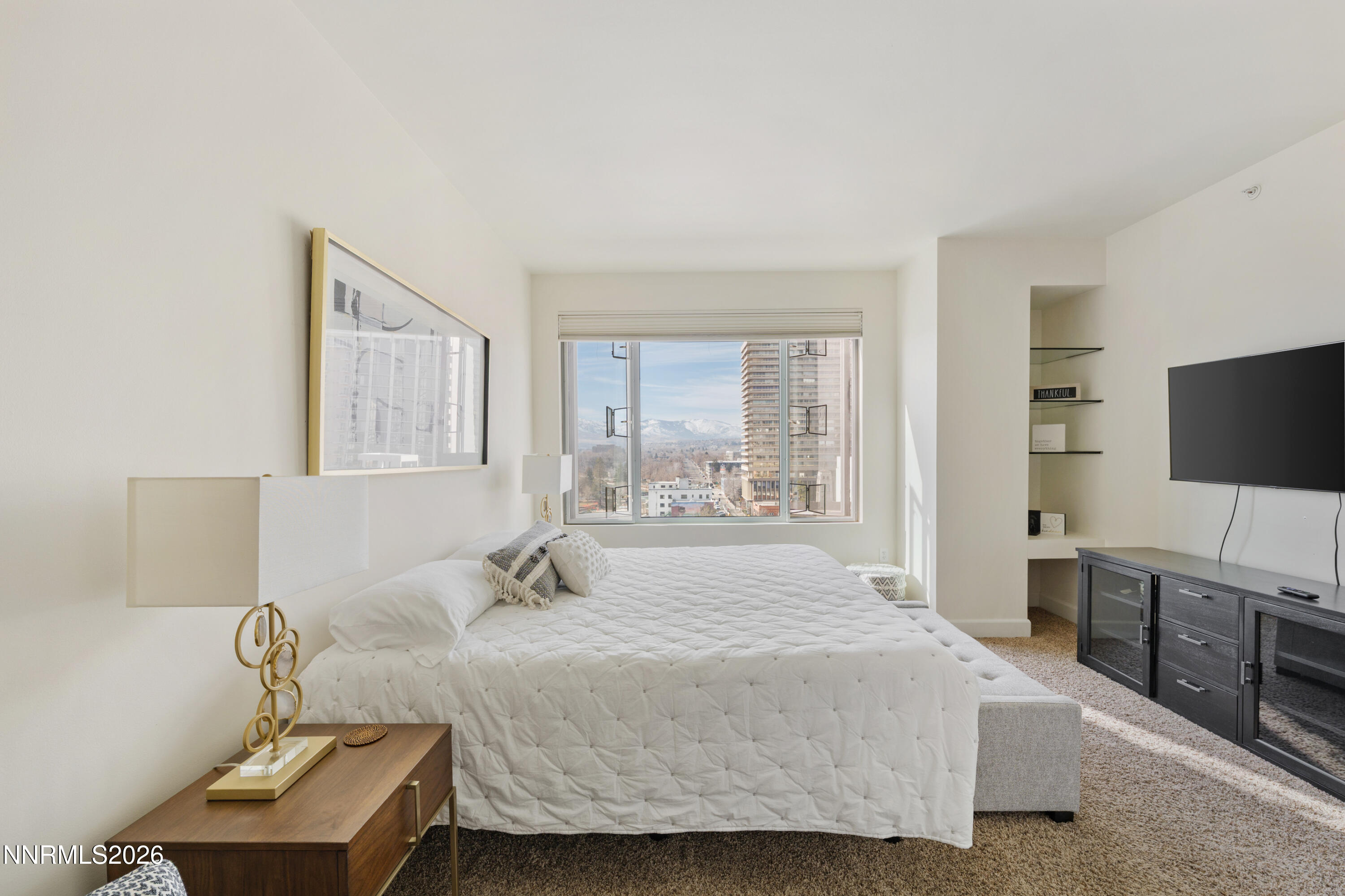 50 North Sierra Street, Unit 903 Reno, NV 89501 - Photo 34 of 61 a bedroom with a bed and a flat screen tv