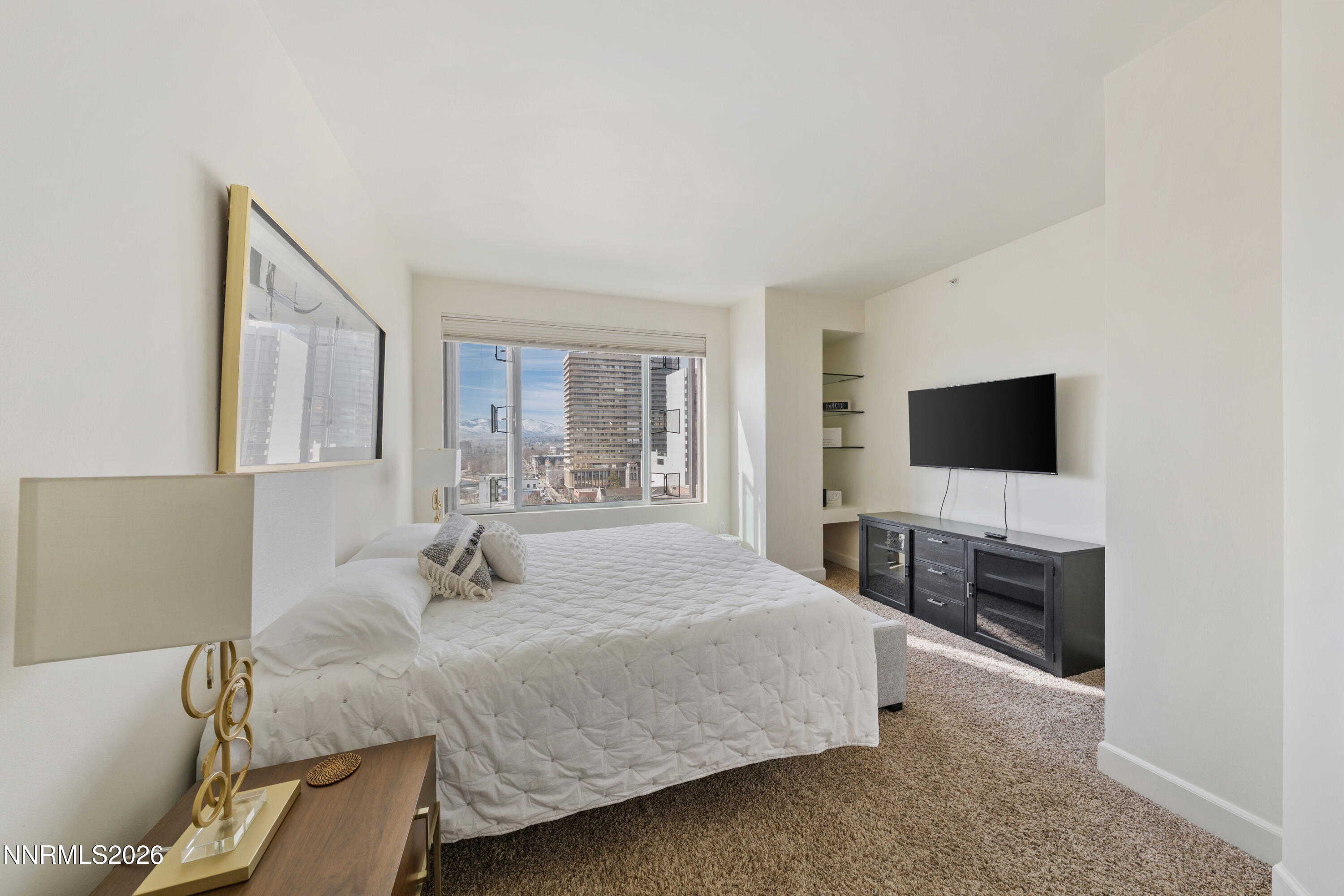 50 North Sierra Street, Unit 903 Reno, NV 89501 - Photo 35 of 61 a bedroom with a bed and a flat screen tv