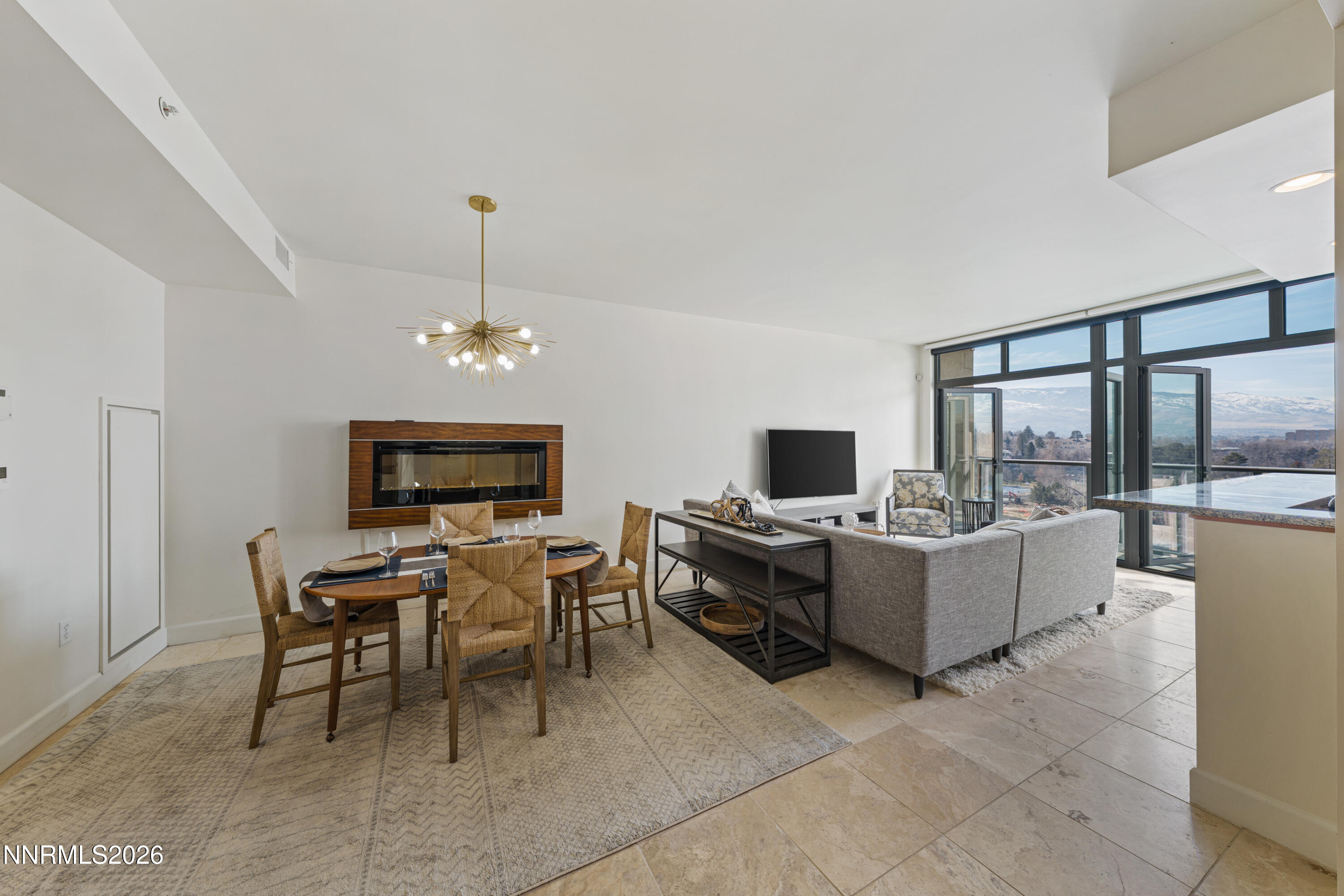 50 North Sierra Street, Unit 903 Reno, NV 89501 - Photo 39 of 61 a living room with fireplace furniture and a flat screen tv