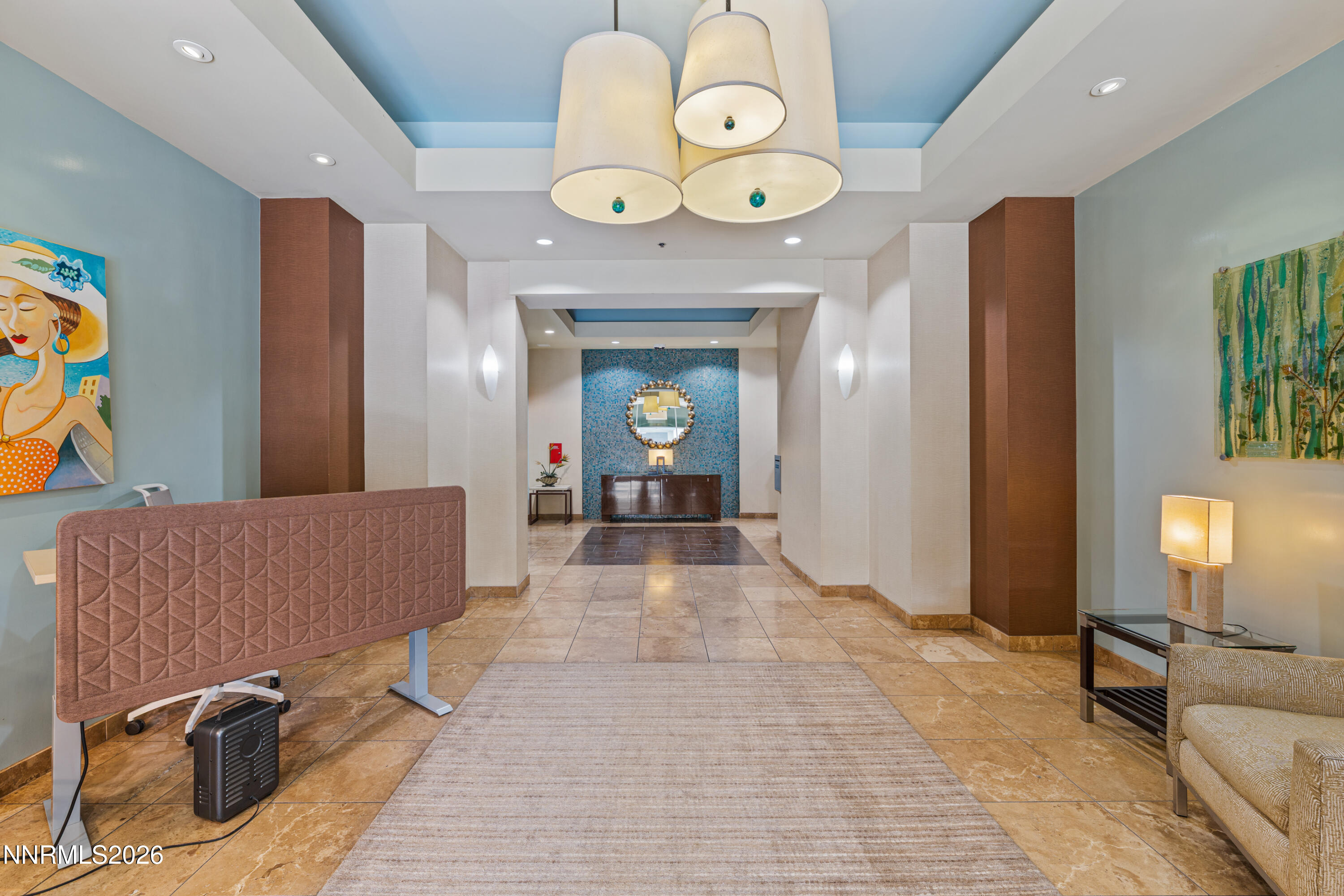 50 North Sierra Street, Unit 903 Reno, NV 89501 - Photo 47 of 61 a view of a hallway with wooden floor and a chandelier