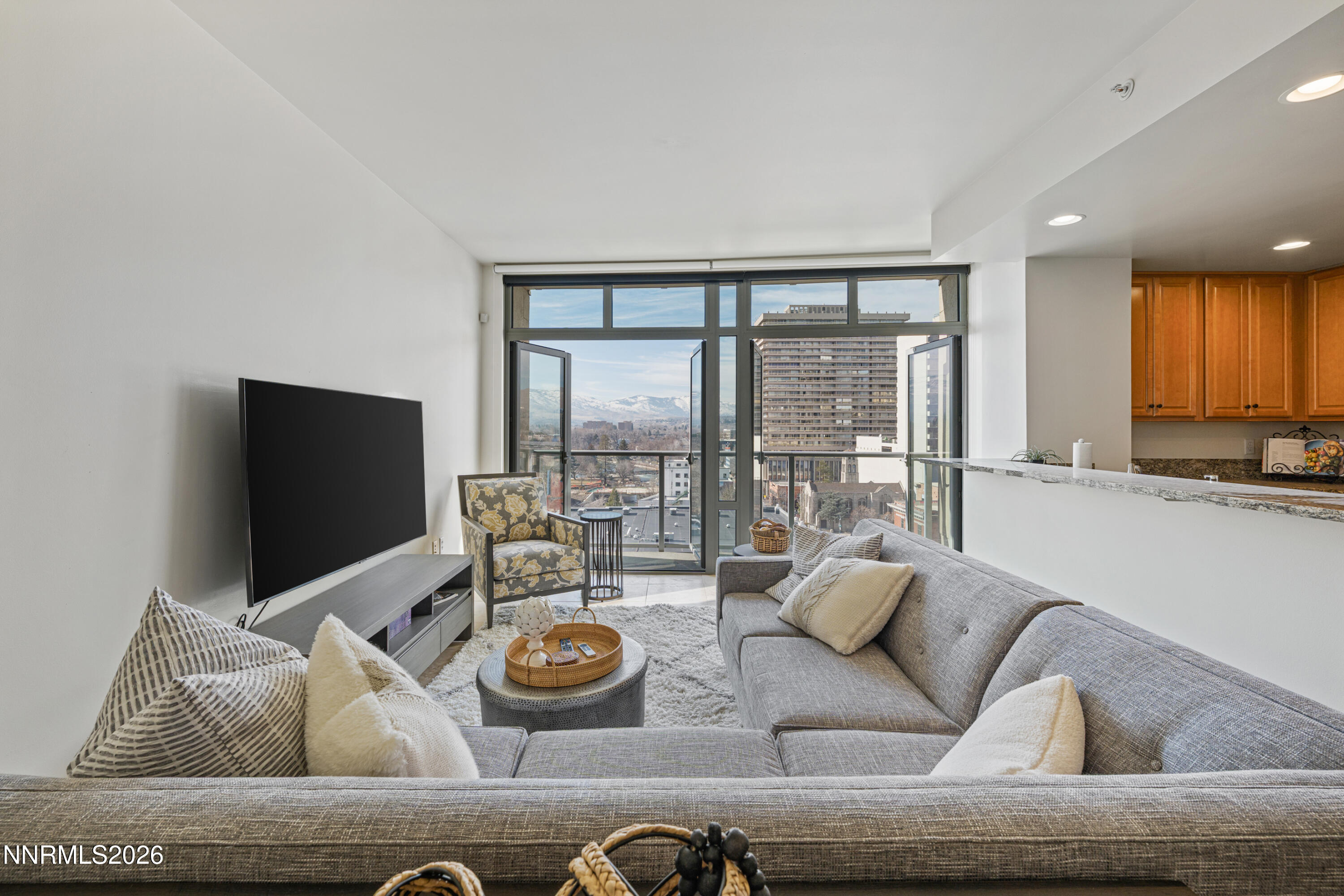 50 North Sierra Street, Unit 903 Reno, NV 89501 - Photo 6 of 61 a living room with furniture and a flat screen tv