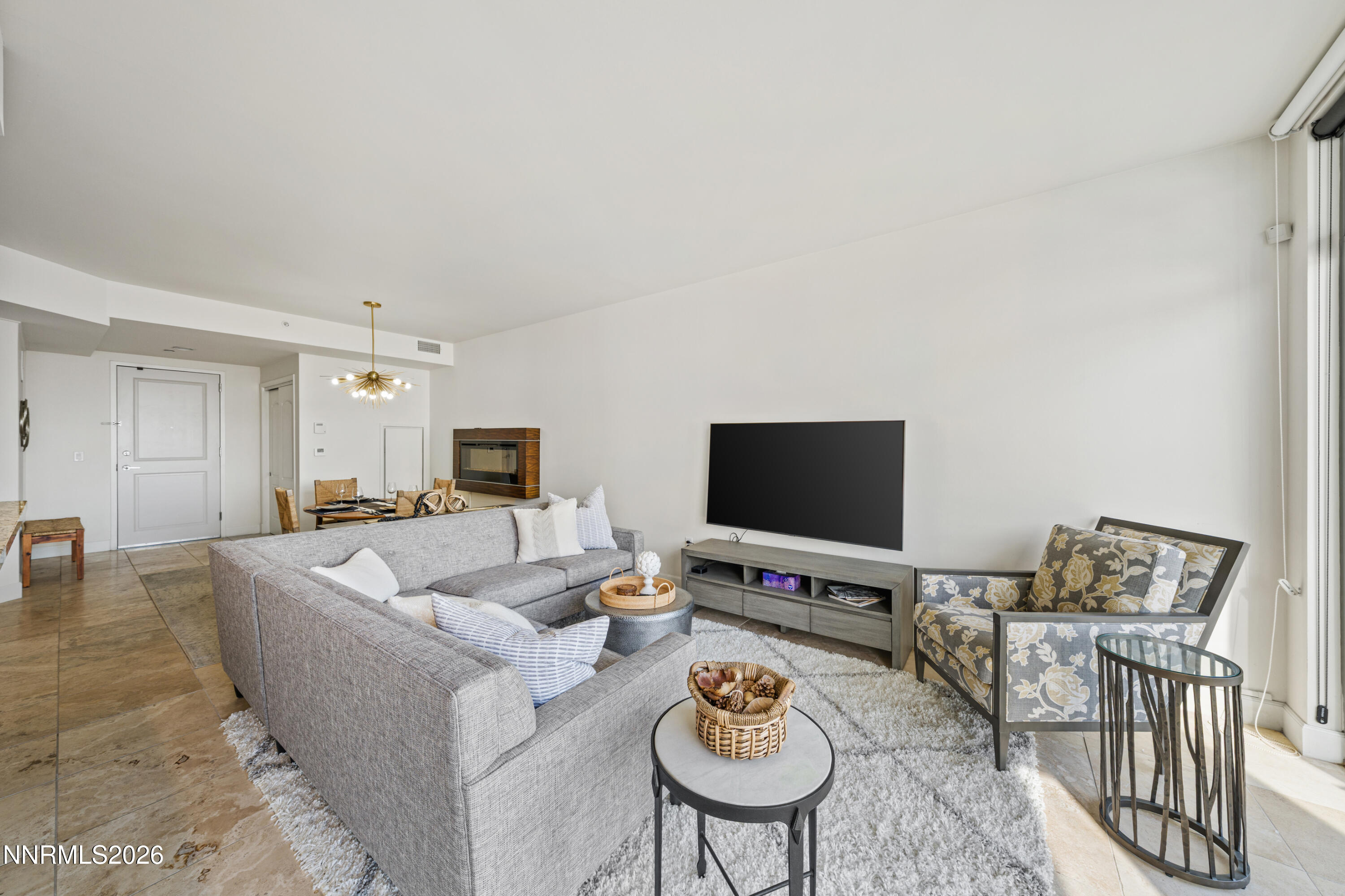 50 North Sierra Street, Unit 903 Reno, NV 89501 - Photo 8 of 61 a living room with furniture and a flat screen tv