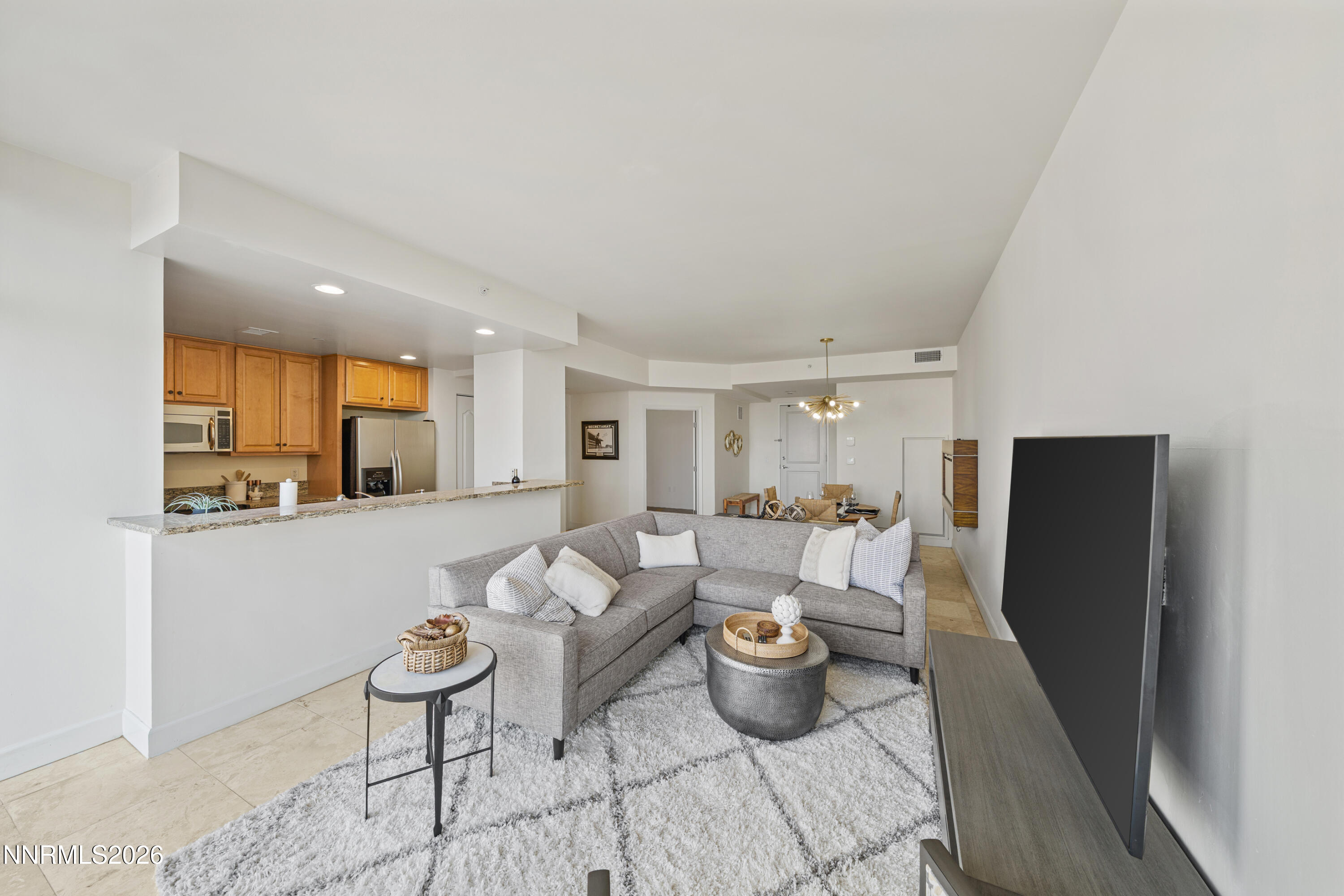 50 North Sierra Street, Unit 903 Reno, NV 89501 - Photo 9 of 61 a living room with furniture a window and a table