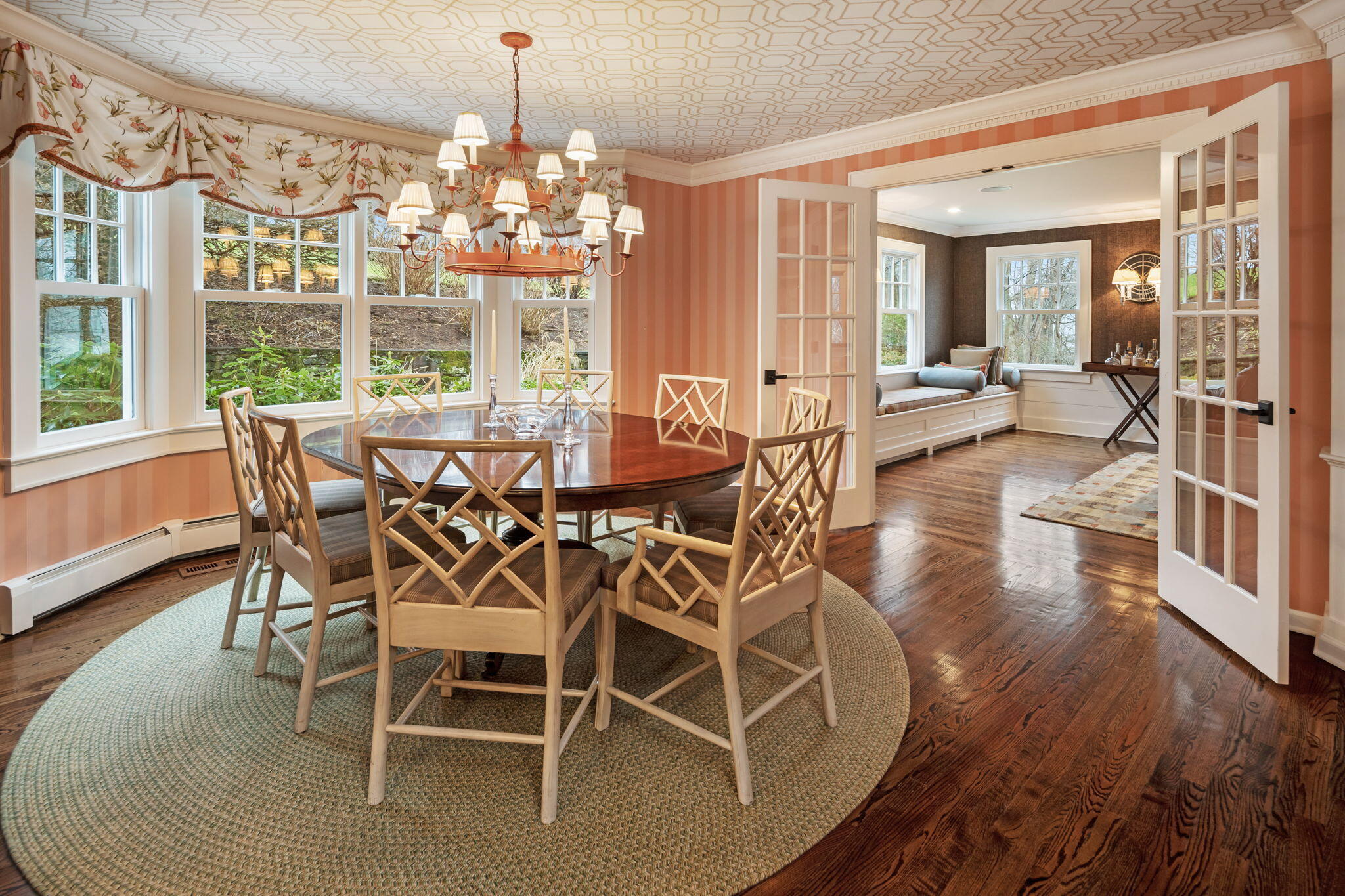 4 Green Beech Drive Rowayton, CT 06853 - Photo 12 of 39 a dining room with wooden floor a chandelier a wooden table and chairs