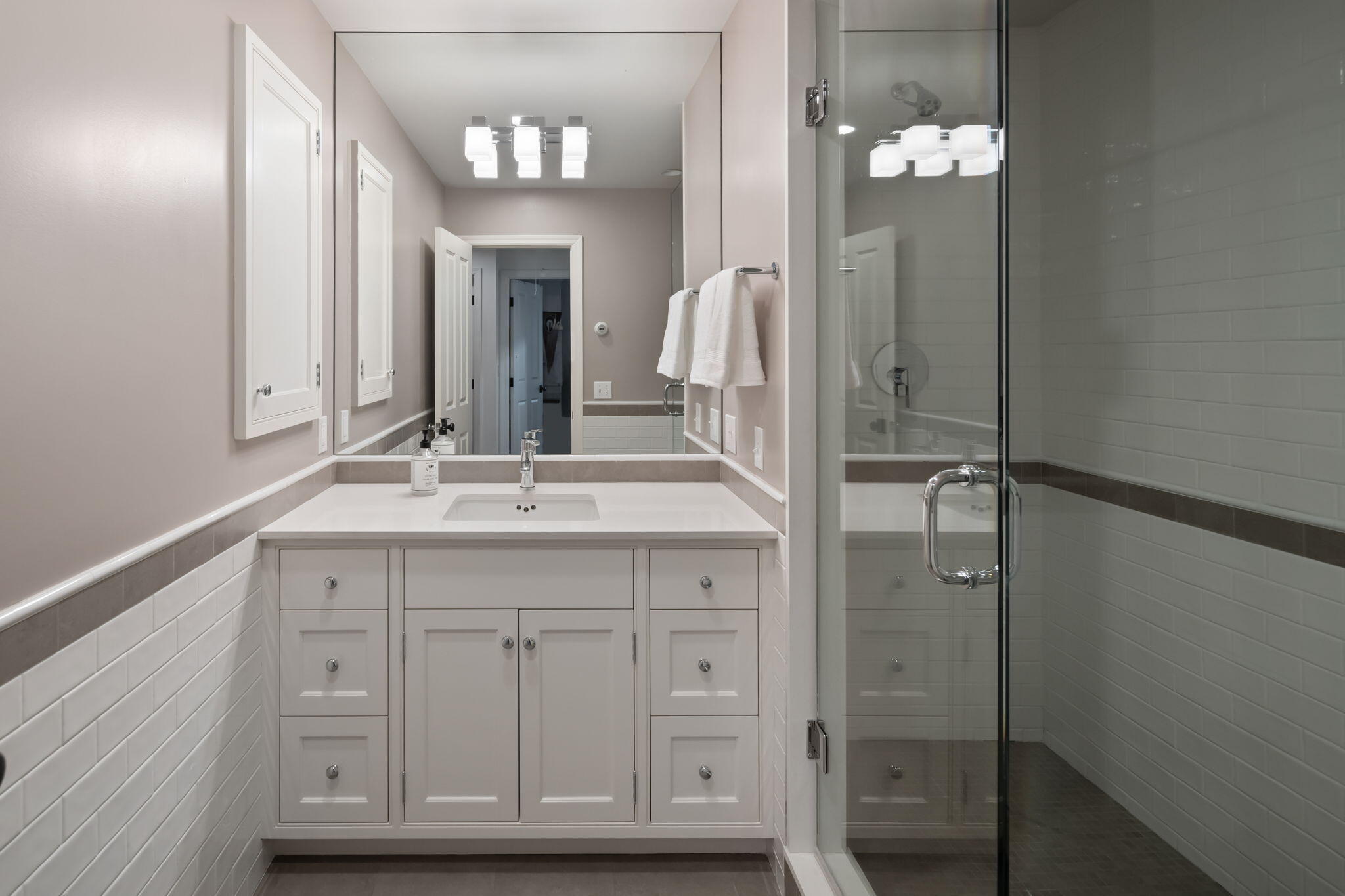 4 Green Beech Drive Rowayton, CT 06853 - Photo 29 of 39 a bathroom with a double vanity sink and a mirror