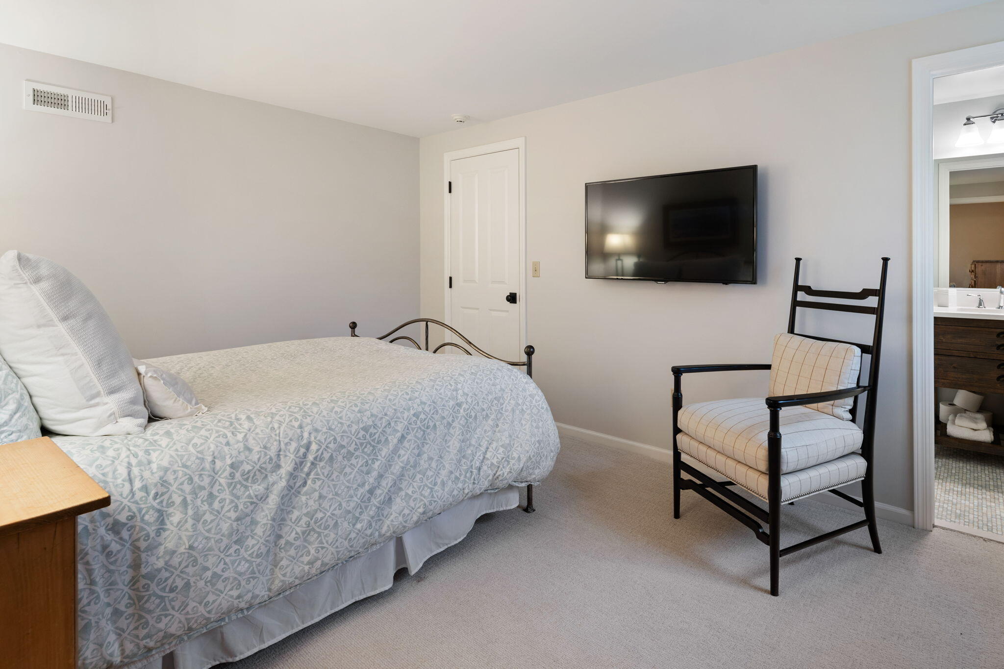 4 Green Beech Drive Rowayton, CT 06853 - Photo 34 of 39 a bedroom with a bed and a flat screen tv