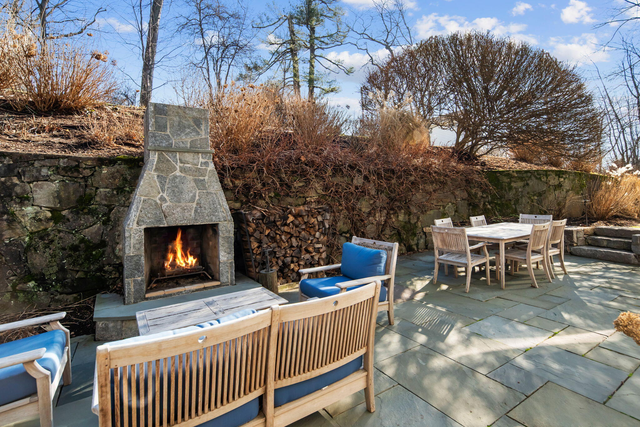 4 Green Beech Drive Rowayton, CT 06853 - Photo 36 of 39 a outdoor space with chairs and a fireplace