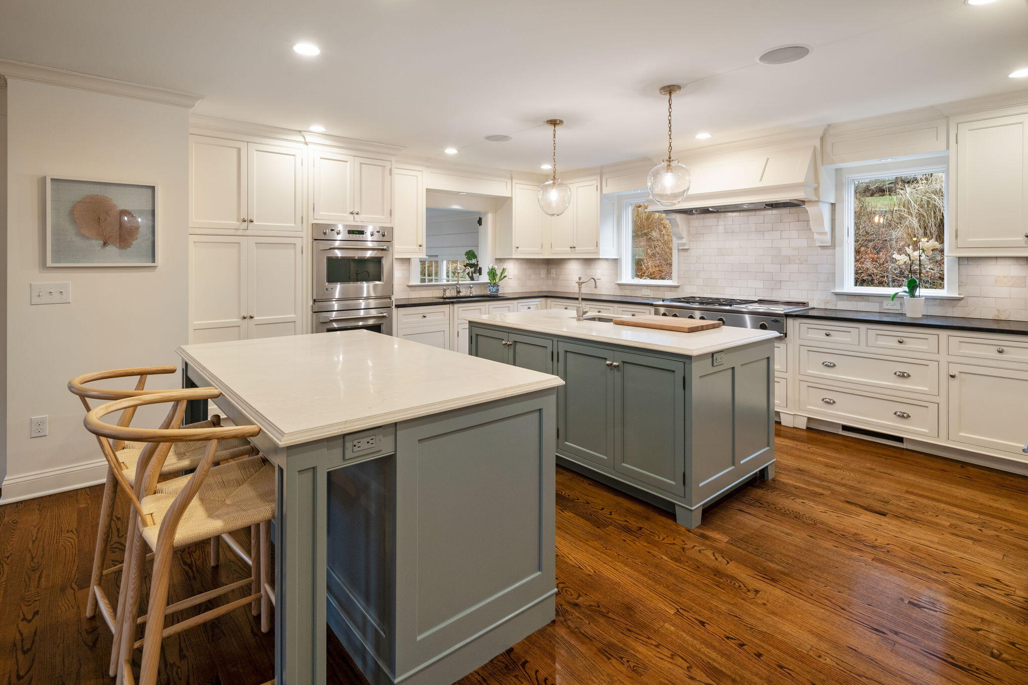 4 Green Beech Drive Rowayton, CT 06853 - Photo 4 of 39 a kitchen with kitchen island a stove a table and chairs in it