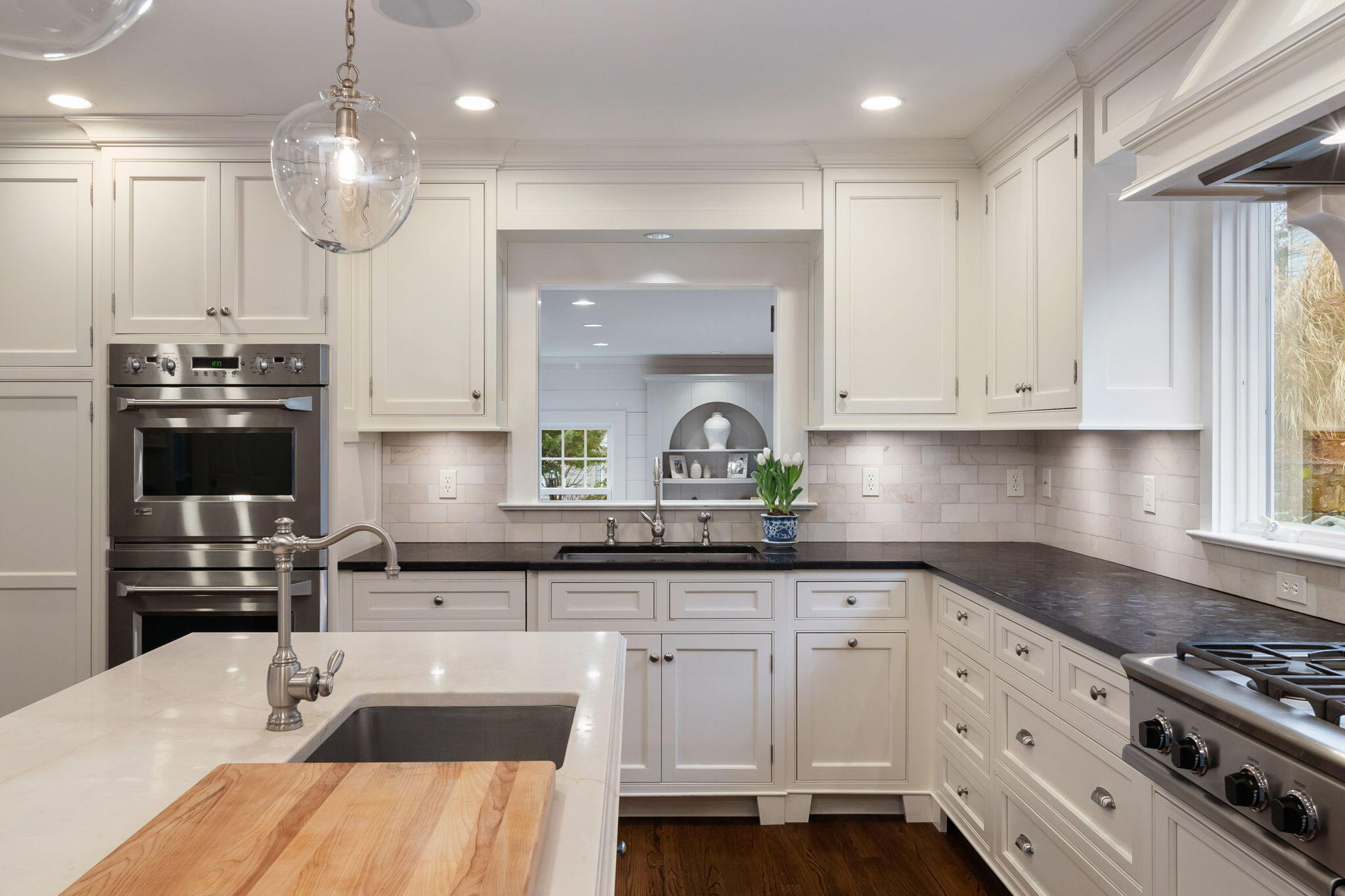 4 Green Beech Drive Rowayton, CT 06853 - Photo 6 of 39 a kitchen with kitchen island granite countertop a sink a counter space appliances and cabinets